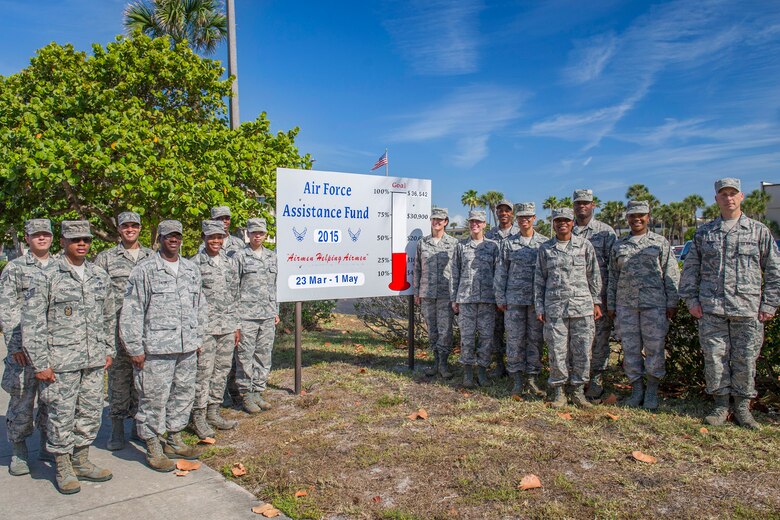 Maj. Gen. (Sel) Nina Armagno, 45th Space Wing commander, and Air Force Assistance Fund key representatives stand by the 2015 AFAF sign at Patrick Air Force Base, Fla. The campaign runs until May 1 and the goal is to raise $36,542. The AFAF raises money that benefits four charities – Air Force Aid Society, Air Force Enlisted Village, Air Force Villages (Texas Over Blue Skies) Charitable Foundation and the General and Mrs. Curtis E. LeMay Foundation. (U.S. Air Force photo/Matthew Jurgens) (Released)