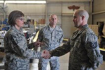 ALTUS AIR FORCE BASE, Okla. – U.S. Air Force Chief Master Sgt. Vicki Gamble, Air Mobility Command command chief, shakes hands with U.S. Air Force Tech. Sgt. Matthew Treadwell, 97th Security Forces Squadron combat arms training and maintenance instructor, April 7, 2015. Gamble spoke with Treadwell and others about current issues within the Air Force and received insight to how the 97th SFS accomplishes their mission. (U.S. Air Force photo by Senior Airman Dillon Davis/Released)
