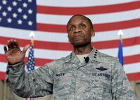 ALTUS AIR FORCE BASE, Okla. –U.S. Air Force Gen. Darren McDew, Air Mobility Command commander, addresses Altus Airmen at an all call, April 8, 2015. McDew spoke to Airmen about being able to recognize problems and take initiative to make needed changes. (U.S. Air Force photo by Airman 1st Class Nathan Clark/Released)
