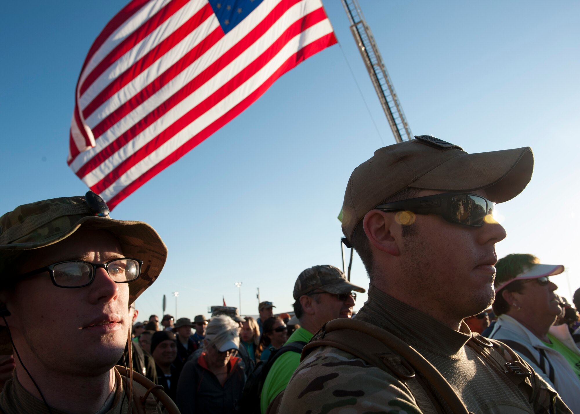 Airman 1st Class Nicholas Maggelet, a 19th Logistics Readiness Squadron aircraft services member, along with Staff Sgt. Christopher Decker, a 19th LRS aerial delivery supervisor, participate in the Bataan Memorial Death March at White Sands Missile Range, N.M. March 22, 2015. The participants were able to meet and speak with World War II survivors of the Bataan Death March before the march. (U.S. Air Force photo by Airman 1st Class Scott Poe) 
