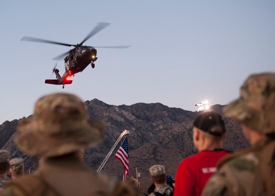 A U.S. Army Blackhawk performs a flyover March 22, 2015, during the opening ceremony of the Bataan Memorial Death March at White Sands Missile Range, N.M. The 26.2-mile march is designed to show participants what the prisoners of war at Bataan endured, even though the POWs actually marched more than 60 miles without food or water, many were beaten, and some never made it to the end. (U.S. Air Force photo by Airman 1st Class Scott Poe)