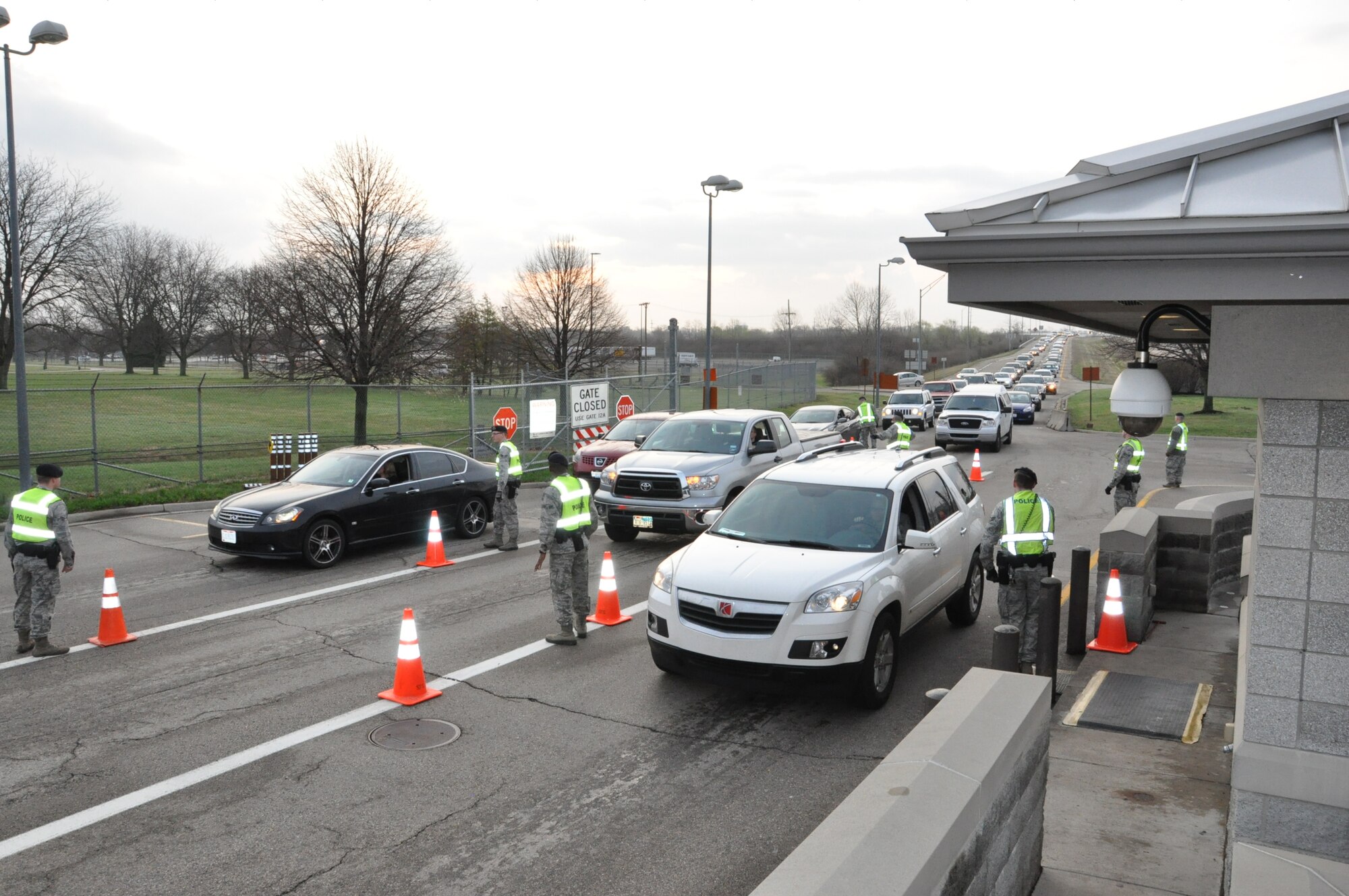 Traffic moves through Gate 15A at Wright-Patterson AFB on April 8, 2015.  The main headquarters gate is closed for repairs and upgrades, and Gate 15A is absorbing most of the extra traffic during the construction period.  US Air Force Photo by Jim Mitchell.