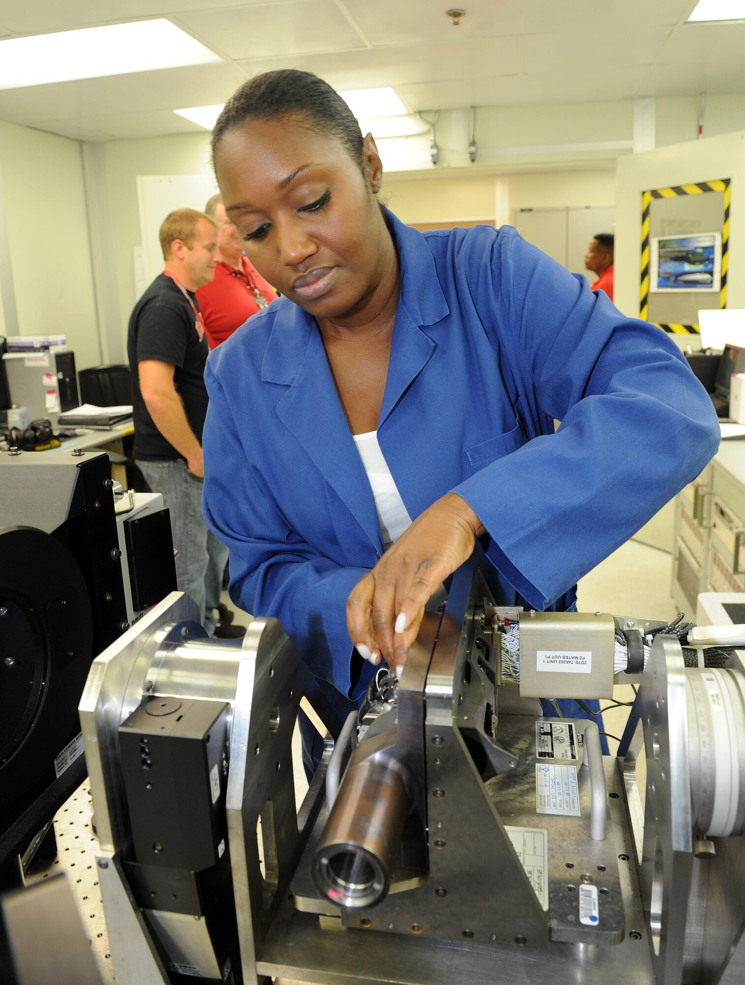 Diyonda Williams, a 402nd Electronics Maintenance Group electronics mechanic, runs tests on the Laser Spot Tracker Television of a Sniper XR Advanced Targeting Pod. (U.S. Air Force photo by Tommie Horton)