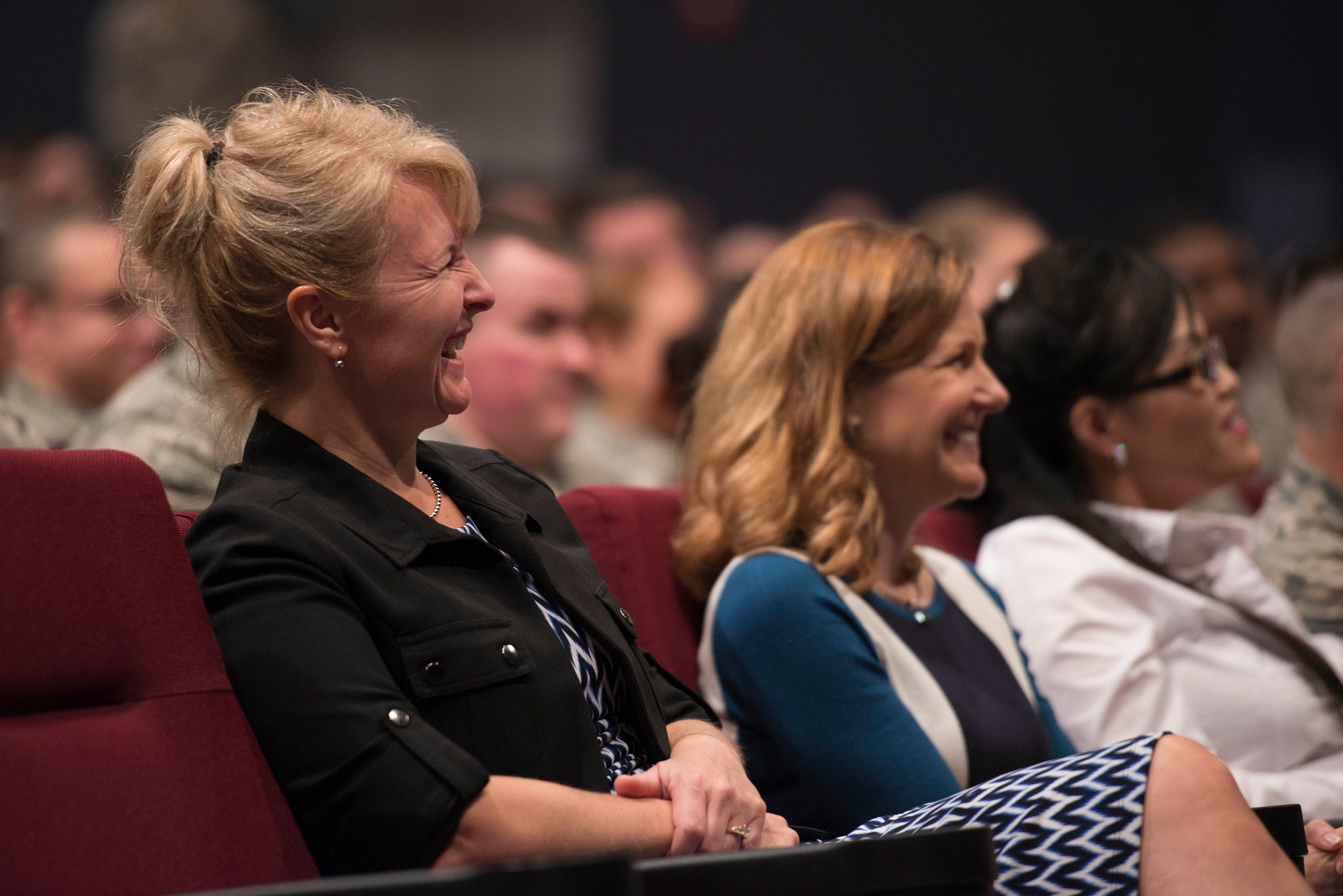 Athena Cody, wife of Chief Master Sgt. of the Air Force James A. Cody, laughs during an all-call at Sheppard Air Force Base, Texas, April 8, 2015. The Codys toured Sheppard to meet with Airmen, thank them for what they do and answer their questions. Both took time to learn more about the 82nd Training Wing and the 80th Flying Training Wing at Sheppard and to mentor Airmen during base-wide all-calls. (U.S. Air Force photo by Senior Airman Kyle Gese/Released)

