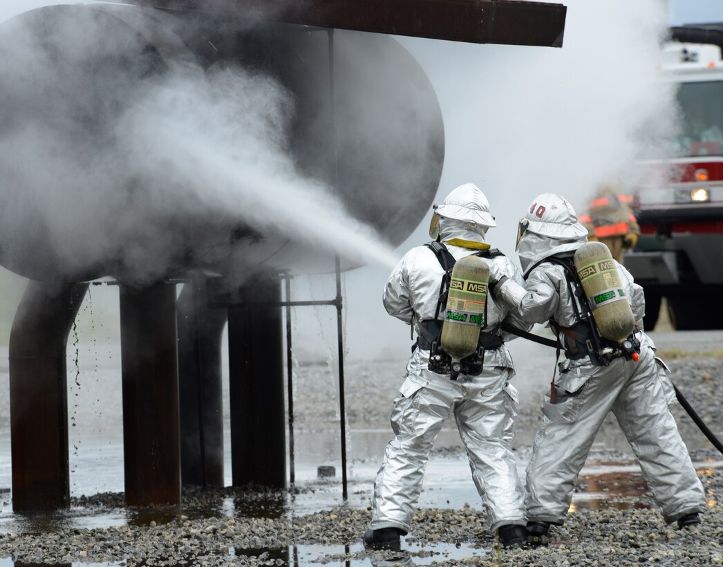 Robins Air Force Base firefighters participated in a semi-annual training drill March 27. The
exercise required two fire trucks equipped with a high-pressure compressed-air water system which uses a smaller water droplet specifically for fuel fires on aircraft. A total of 20 firefighters participated in the training. “We’re making sure they’re following operating
procedures,” said Larry Kohls, deputy chief of operations. Kohls said the training equips firefighters with the skills to ideally set up to fight an aircraft or fuel fire. (U.S. Air Force photo by Ed Aspera)