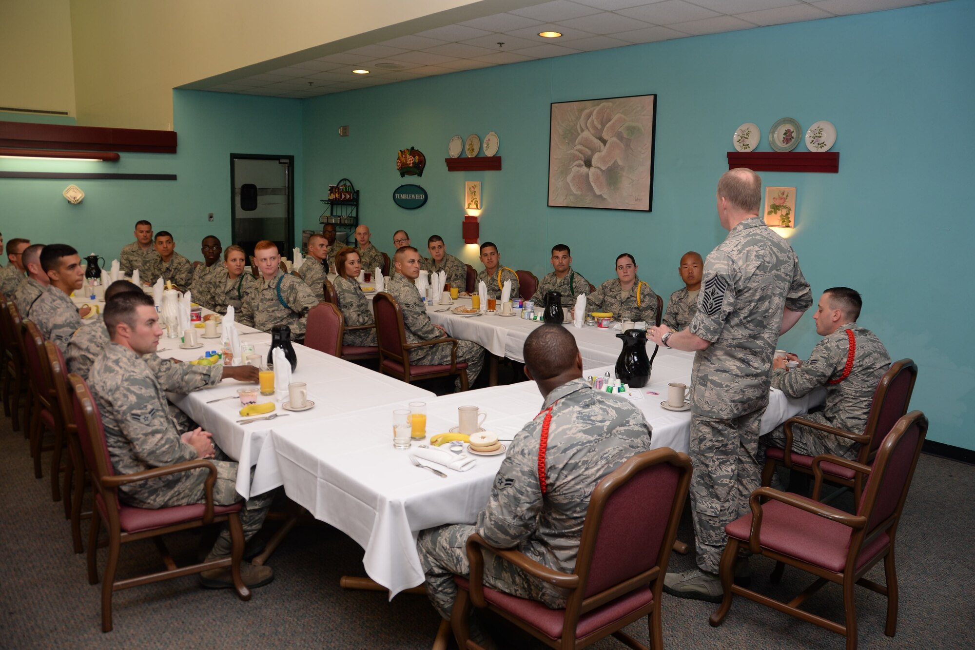 Chief Master Sgt. of the Air Force James A. Cody met with Airmen in Training at the Tumbleweed Dining Facility, April 8, 2015, at Sheppard Air Force Base, Texas. Cody and his wife, retired Chief Master Sgt. Athena Cody, toured Sheppard to meet with Airmen, thank them for what they do and answer their questions. Cody met with Airmen during breakfast to learn about their daily routine and to receive feedback on the newly implemented “capstone week” during basic training. (U.S. Air Force photo by Airman 1st Class Robert L. McIlrath/Released)

