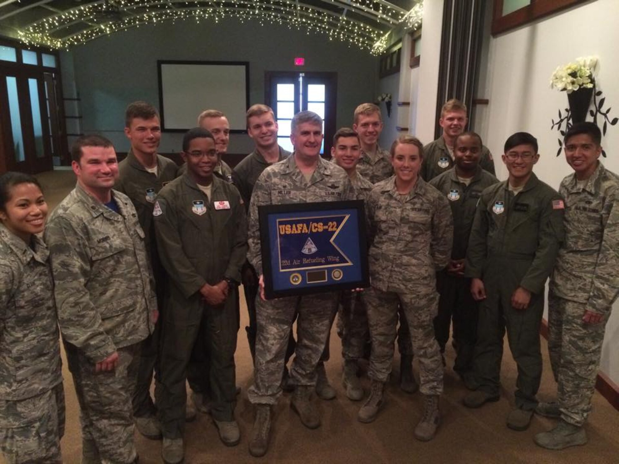 Col. Albert Miller, 22nd Air Refueling Wing commander, poses with McConnell Airmen and several Academy‬ cadets from Squadron 22 on their visit to McConnell Air Force Base, Kan., April 3, 2015. The 22 ARW is the sponsor base of the 22nd Squadron at the Academy. Cadets from all four classes came to McConnell to observe, first-hand, what life is like on active duty and in the operational Air Force. (U.S. Air Force photo by 1st Lt Jessica Brown)
