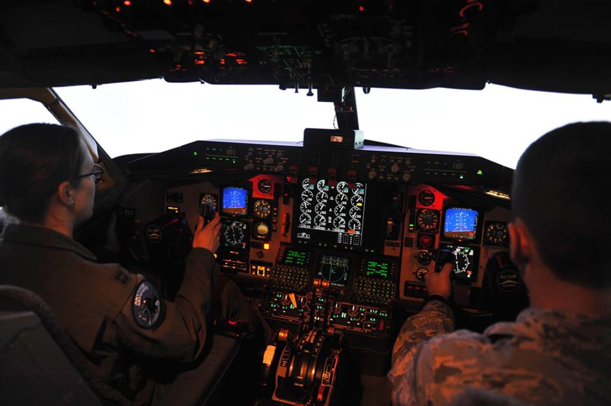 U.S. Air Force Academy cadet C4C Remington Hoyer from Squadron 22 learns how to use the KC-135 Stratotanker aircraft simulator from Capt. Kari Benson of the 344th Air Refueling Squadron while on a visit to McConnell Air Force Base, Kan., April 3, 2015. The 22nd Air Refueling Wing is the sponsor base of the 22nd Squadron at the Academy, cadets from all four classes came to McConnell to get first-hand experience in the operational Air Force. (U.S. Air Force photos by 2nd Lt Krystal Jimenez)