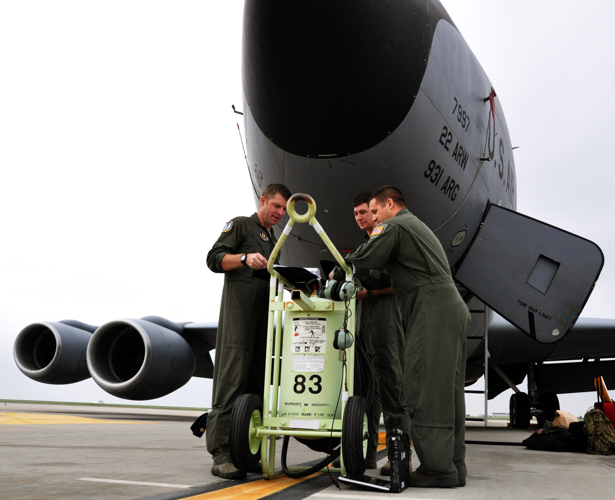 Pilots Capt. Bryce Sager, Maj. Jason Helmick and refueling boom operator Master Sgt. Aaron Meadows, all members of the Air Force Reserve 18th Air Refueling Squadron, 931st Air Refueling Group, McConnell Air Force Base, Kan., conduct mission planning and pre-flight briefings, April 8, 2015.  Aircrew members meet several hours before departure to review the mission as well as go over contingency plans and safety briefings.  The three aircrew members were preparing to operate a KC-135 Stratotanker on an air refueling exercise, during which they refueled a B-52 Statofortress assigned to Barksdale Air Force Base, La.  (U.S. Air Force photo by Capt. Zach Anderson)