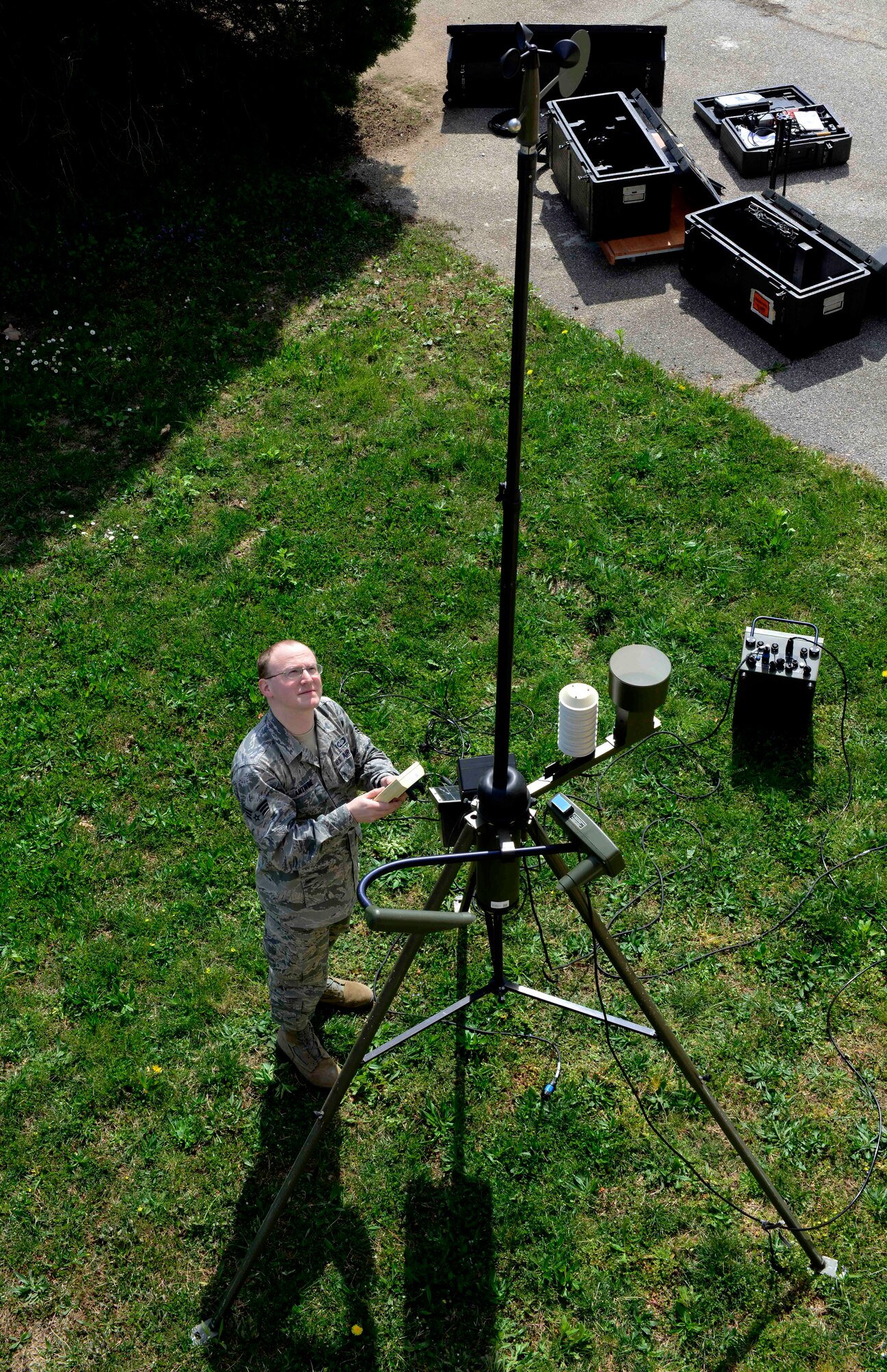 U.S. Air Force Senior Airman Aaron Antwine, 31st Operations Support Squadron weather forecaster, operates a TMQ-53 automated observing weather station, April 8, 2015 at Aviano Air Base, Italy. To ensure the base population safety, weather personnel prepare forecasts and issue up-to-date weather warnings during hazardous conditions. (U.S. Air Force photo by Senior Airman Areca T. Wilson/Released)