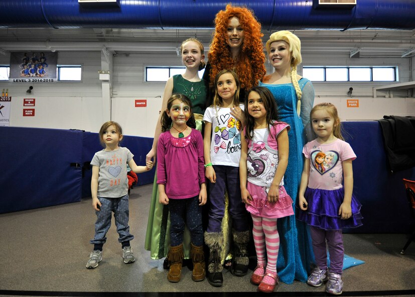 Children gather to take a photo opportunity with the characters from the Disney film “Frozen” during the Beautiful Child Photo Shoot and Activity Fair on April 7, 2015, at Liberty Square on Grand Forks Air Force Base, N.D. Members from the Bel Canto Studio of Voice sung an arrangement of songs from the Frozen to entertain children and promote healthy singing techniques, proper vocal development along with musical involvement in community activities and services. (U.S. Air Force photo by Senior Airman Xavier Navarro/released)