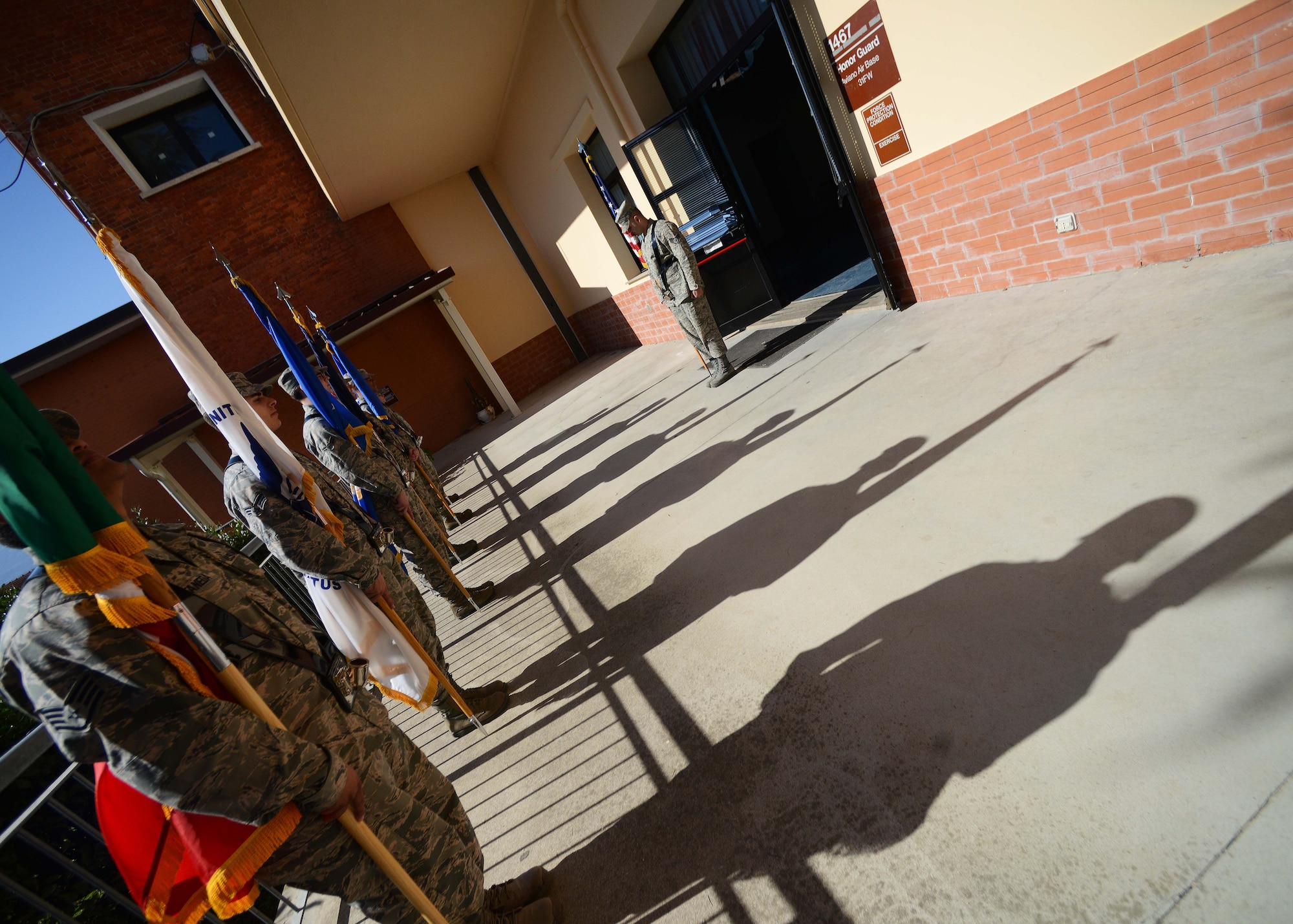 Members of the 31st Fighter Wing honor guard perform flag movements during practice, April 8, 2015, at Aviano Air Base, Italy. The 31st Fighter Wing honor guard provides military honors for official military and civilian ceremonies. (U.S. Air Force photo by Airman 1st Class Deana Heitzman/Released)  