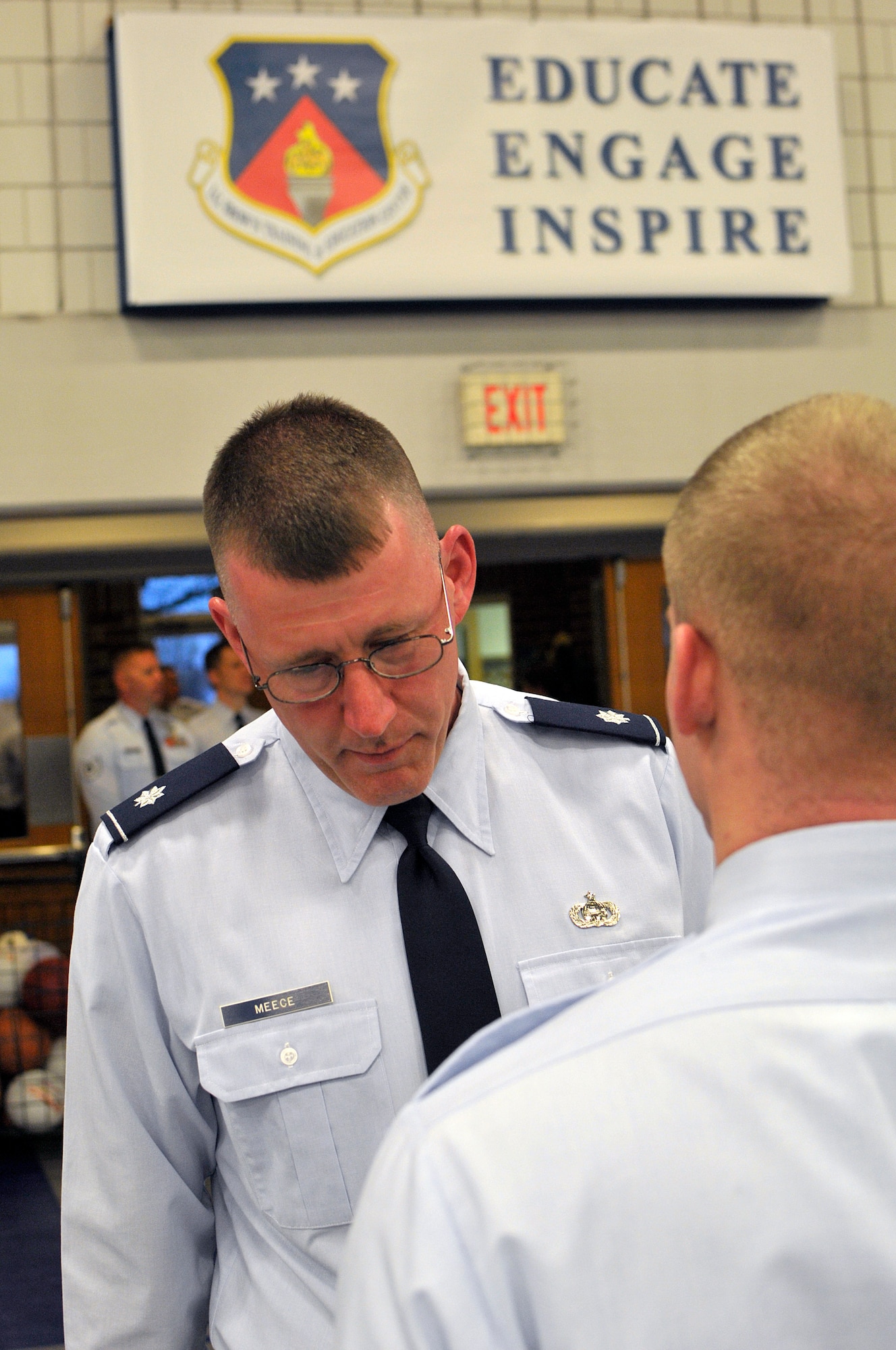 MCGHEE TYSON AIR NATIONAL GUARD BASE, Tenn. - Lt. Col. David Meece, deputy commander, inspects uniforms during the commandant's inspection for Airman leadership school March 30, 2015, at the I.G. Brown Training and Education Center. Students undergo three uniform inspections during their weeks of leadership studies.  (U.S. Air National Guard photo by Master Sgt. Mike R. Smith/Released)