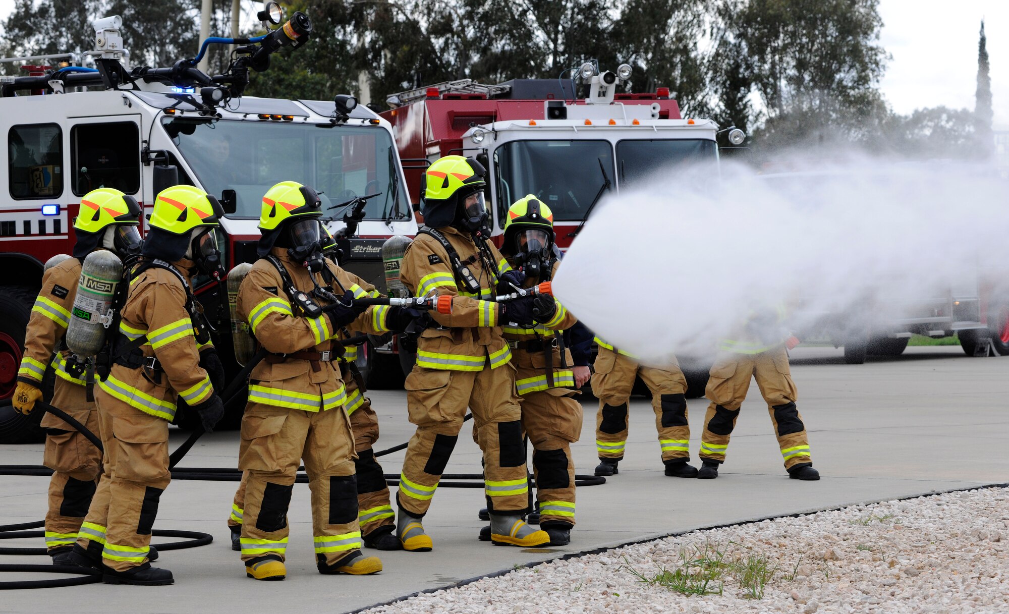 Firefighters from the 39th Civil Engineer Squadron Incirlik Fire Emergency Services and leadership from the 39th Air Base Wing prepare to train on how to extinguish a fire inside the deck of an aircraft April 2, 2015, at Incirlik Air Base, Turkey. The leadership embedded into the training as part of the commander’s Out Connecting with Airmen program, which lets leadership experience what type of work Airmen at Incirlik do on a day-to-day basis. (U.S. Air Force photo by Senior Airman Krystal Ardrey/Released)