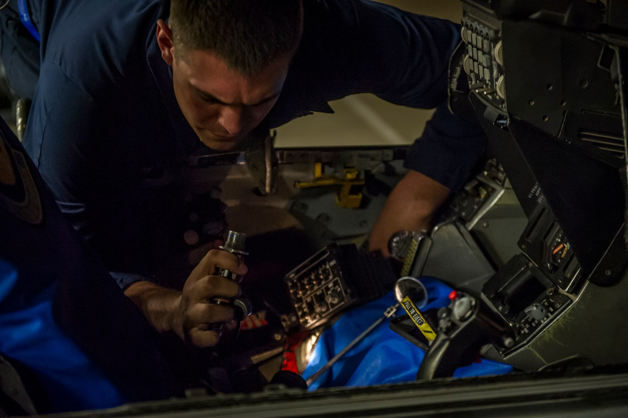 Senior Airman Joseph Meister, 54th Aircraft Maintenance Squadron avionics journeyman, reprograms avionic equipment in an F-16 Fighting Falcon at Holloman Air Force Base, N.M., April 8, 2015. After spending a few years working with nuclear weapons, Meister said he was ready for a change and chose to become a crew chief. “The examples set by those who came before us really keeps me motivated,” said Meister. “My dad and grandpa were both in the military, so they really inspired me to join. I never thought I would have the opportunity to go the places I’ve gone and I’m really thankful that I can be part of what keeps these jets up in the air.” (U.S. Air Force photo by Airman 1st Class Aaron Montoya / Released)