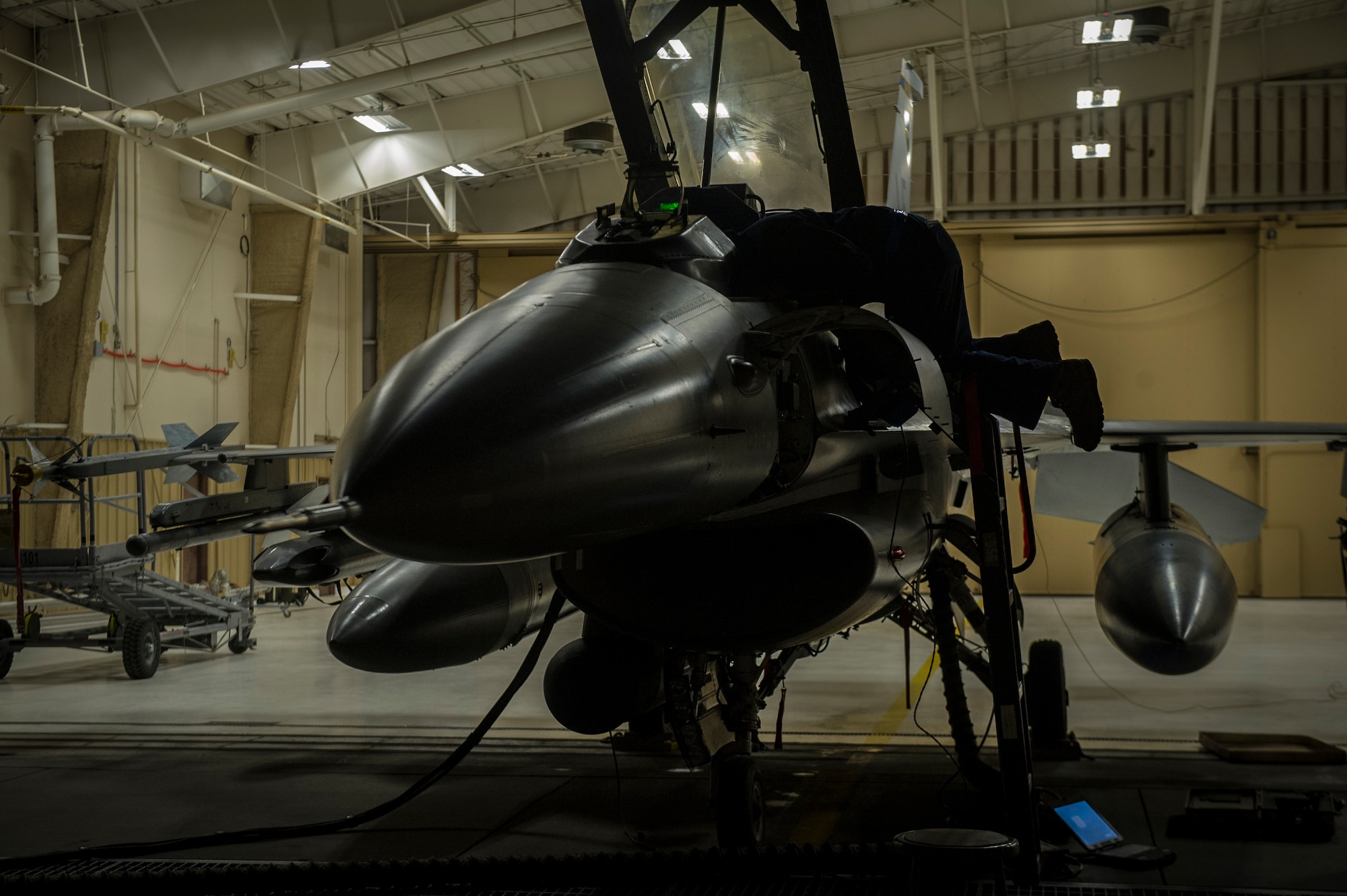 Senior Airman Joseph Meister, 54th Aircraft Maintenance Squadron avionics journeyman, reprograms avionic equipment in an F-16 Fighting Falcon at Holloman Air Force Base, N.M., April 8, 2015. “My original job was with nuclear weapons, and I chose to become a crew chief about a year and a half ago,” Meister said. “My dad and grandpa were both in the military, so they really inspired me to join. The examples set by those who came before us really keeps me motivated. I never thought I would have the opportunity to go the places I’ve gone and I’m really thankful that I can be part of what keeps these jets up in the air.” (U.S. Air Force photo by Airman 1st Class Aaron Montoya / Released)