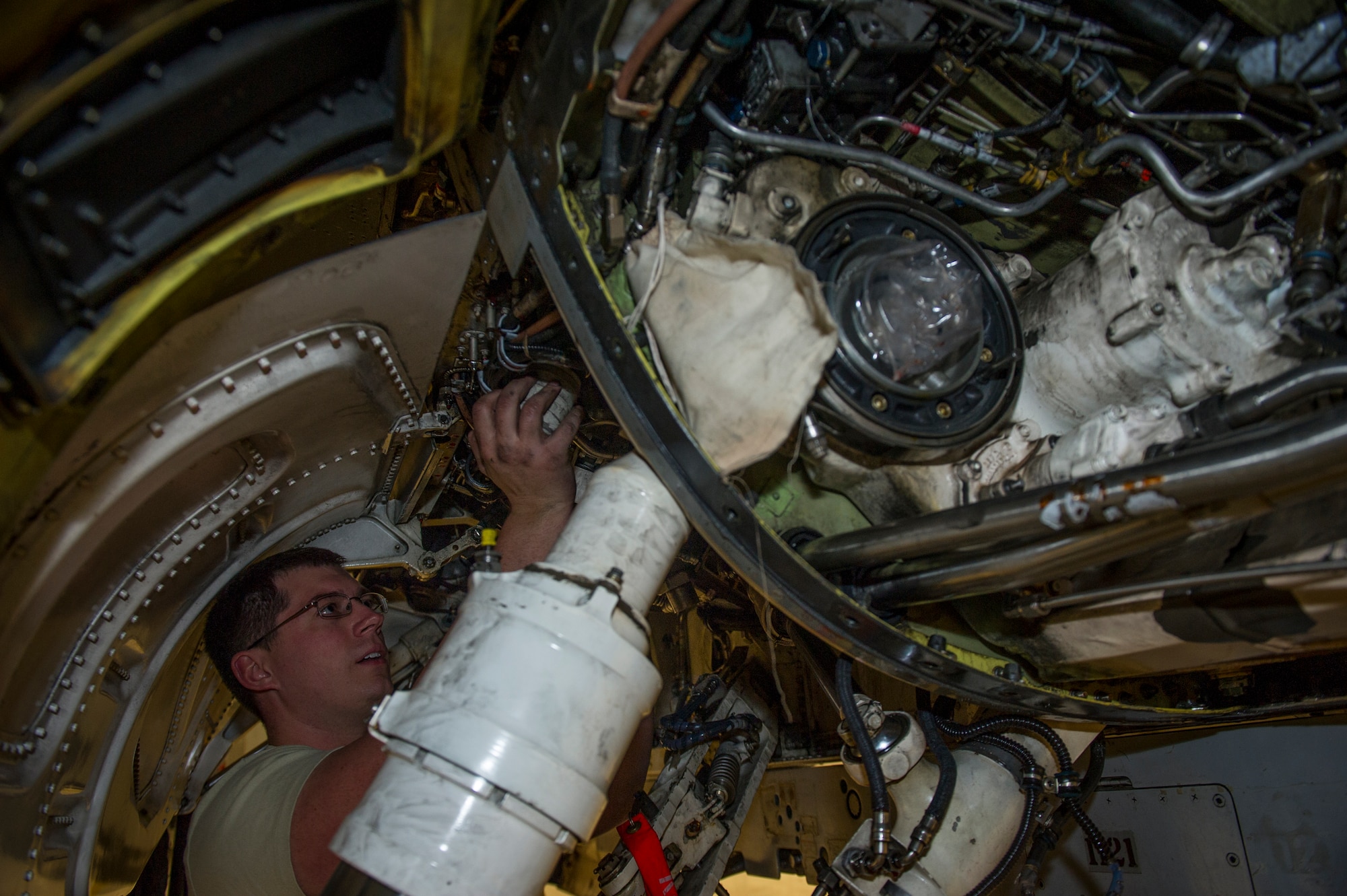 Staff Sgt. Dustin Fontenot, 54th Aircraft Maintenance Squadron crew chief, replaces the B-system hydraulic manifold, hydraulic pump and jet fuel starter on an F-16 Fighting Falcon at Holloman Air Force Base, N.M., April 8, 2015. Fontenot has been a crew chief for eight years and said it has allowed him to go places he never would have gone. “I’m not from a town with a lot of military presence,” Fontenot said. “I saw the opportunities the Air Force could give me and I knew I wanted to join and work on jets. Compared to those who served before us, we have it really easy and that motivates me to work hard. We work on the F-16s that are used to train new fighter pilots, so we know what we are doing is an important part of the mission.” (U.S. Air Force photo by Airman 1st Class Aaron Montoya / Released)