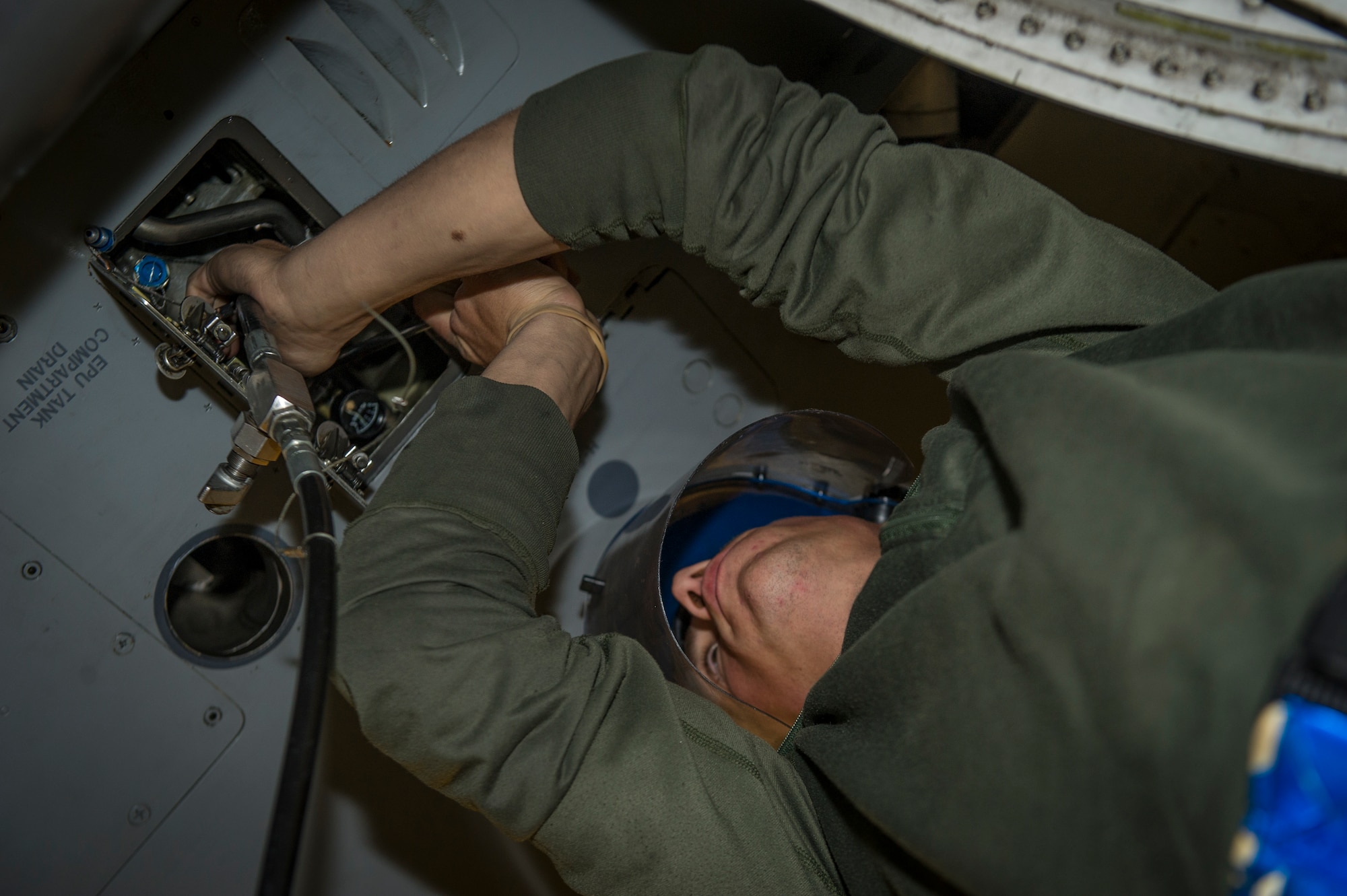 Staff Sgt. Michael McMonigle, 54th Aircraft Maintenance Squadron crew chief, services the Emergency Power Unit on an F-16 Fighting Falcon at Holloman Air Force Base, N.M., April 8, 2015. The EPU is essential to keeping the jet functional if the main power source fails. McMonigle, who has been in the Air Force for eight years, chose his job as a crew chief. “My grandfather was in World War II, so he really inspired and motivated me to serve,” said McMonigle. “Throughout my career, I’ve been able to go to cool places that I never would have imagined. As a crew chief, my job is to maintain the greatest fighter jets and make sure these jets are ready to go anytime.” (U.S. Air Force photo by Airman 1st Class Aaron Montoya / Released)