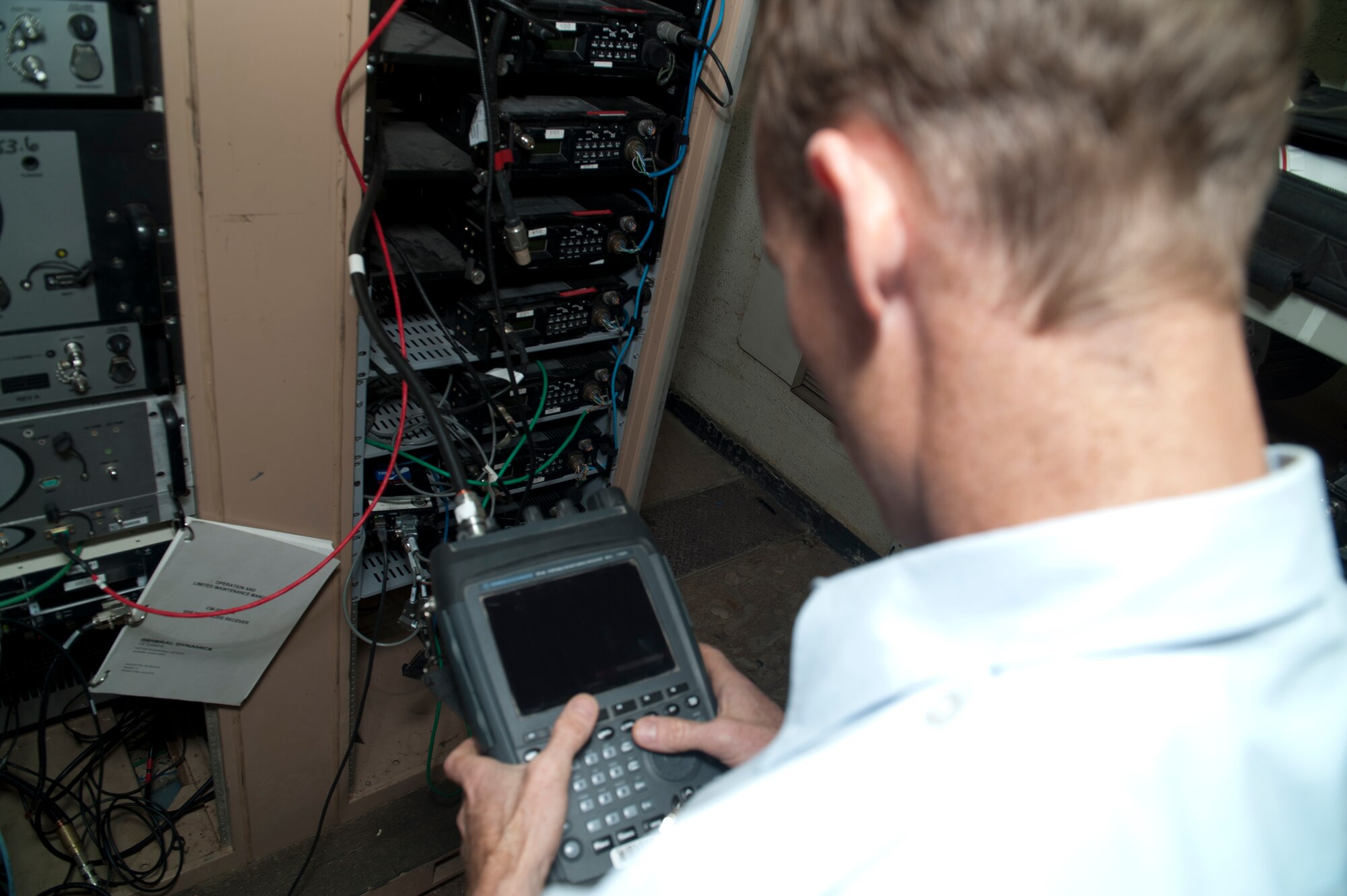 Senior Airman Anthony Payne, Ground Radio technician, runs checks on radio equipment to ensure seamless communication capability for Aircraft operating out of Holloman Air Force Base, N.M., April 8, 2015. Ground Radio communications is responsible for installing, maintaining and repairing fixed and transportable transmitters, receivers, transceivers and related equipment. “Serving has changed my life a lot,” said Payne. “I found something that I love to do, in a career field that I did not choose but I have fallen in love with it. It’s definitely given me a lot more direction in life.” (U.S. Air Force photo by Senior Airman Chase Cannon/Released)