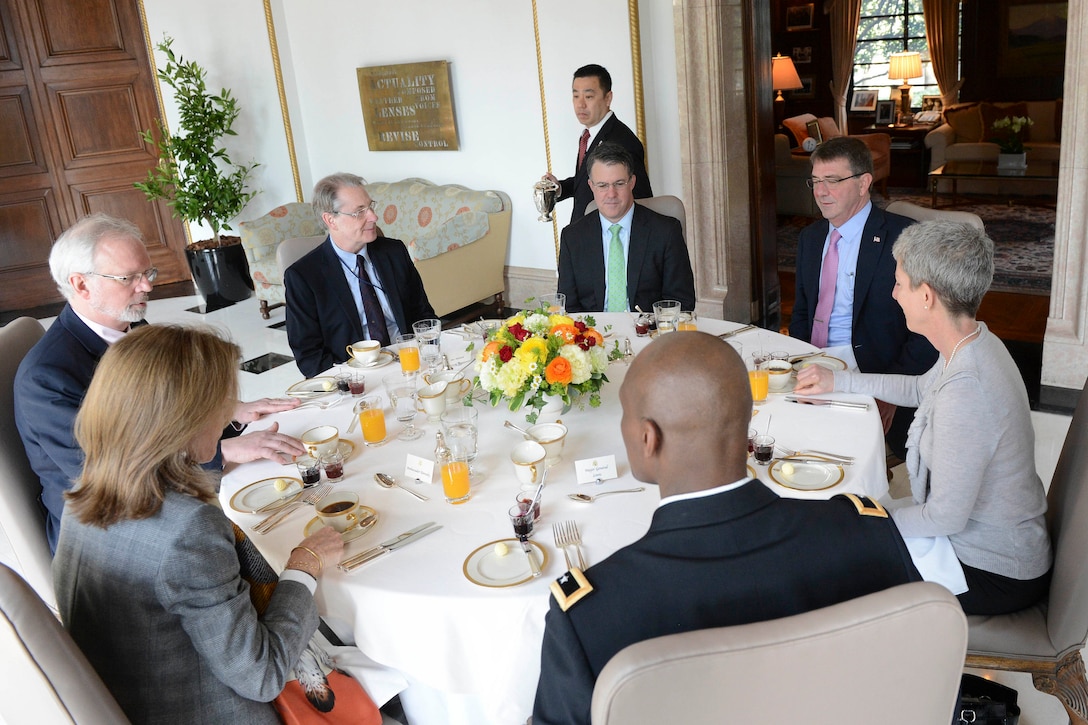 U.S. Defense Secretary Ash Carter, second from right, attends a breakfast with U.S. Ambassador to Japan Caroline Kennedy, left foreground, in Tokyo, April 9, 2015.