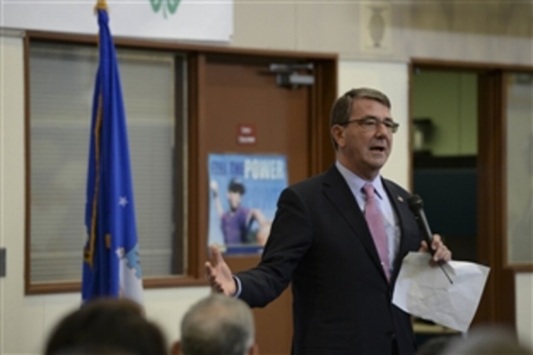 U.S. Defense Secretary Ash Carter talks with service members and families on Yokota Air Base, Japan, April 9, 2015, where he hosted a town hall in observance of Month of the Military Child. Carter is on a visit to the Asia-Pacific region to strengthen ties and reaffirm commitment to the rebalance. 