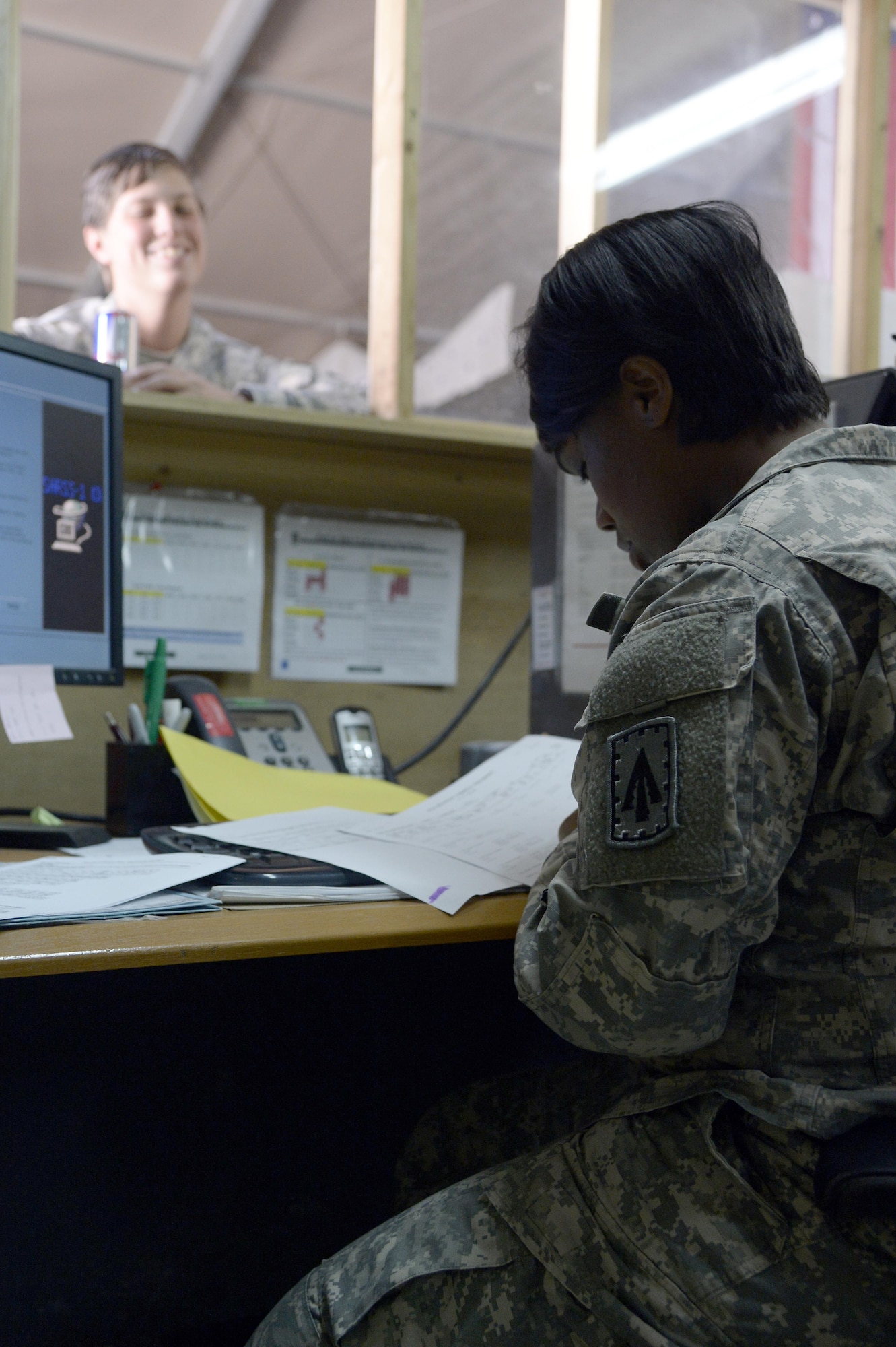 Specialist Shamonica, stock control clerk, reconciles a customer’s document control register against the Supply Support Activity’s standard Army retail supply system-1 of record at an undisclosed location in Southwest Asia April 6, 2015. Stock control, the “nerve” of the SSA, tracks everything that goes on in the warehouse. Shamonica is currently deployed from Fort Bragg, N.C. (U.S. Air Force photo/Tech. Sgt. Marie Brown/RELEASED)