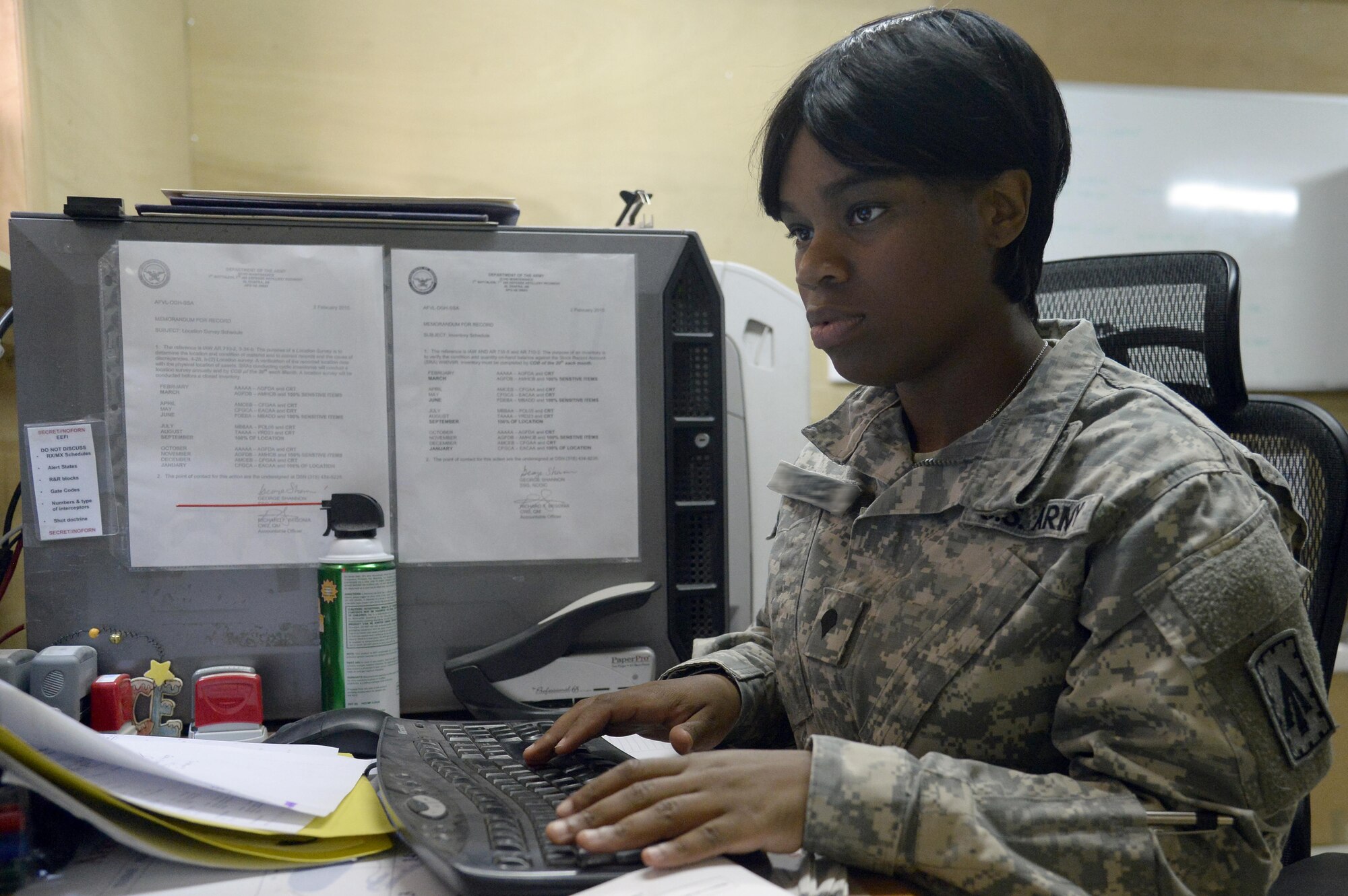 Specialist Shamonica, stock control clerk, performs a time-sensitive process using the standard Army retail supply system-1 of record at an undisclosed location in Southwest Asia April 6, 2015. The stock control section tracks the status on every item that is on order, en route and currently in the warehouse. Shamonica is currently deployed from Fort Bragg, N.C. (U.S. Air Force photo/Tech. Sgt. Marie Brown/RELEASED)