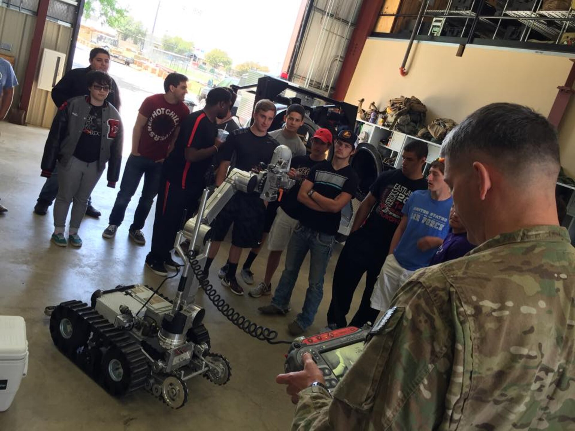 Sixteen Eastland High School physics students observed an Explosive Ordnance Disposal demonstration conducted by Senior Master Sgt. Daniel Montrose, 301st Civil Engineer Squadron EOD unit, April 3 during their 301st Fighter Wing tour here. Students also visited the 610th Security Forces, 457th Fighter Squadron, aircrew flight equipment, 301st Aircraft Maintenance Squadron's engine shop and the flightline with an up-close look at the F-16. (U.S. Air Force photo by Master Sgt. Julie Briden-Garcia)