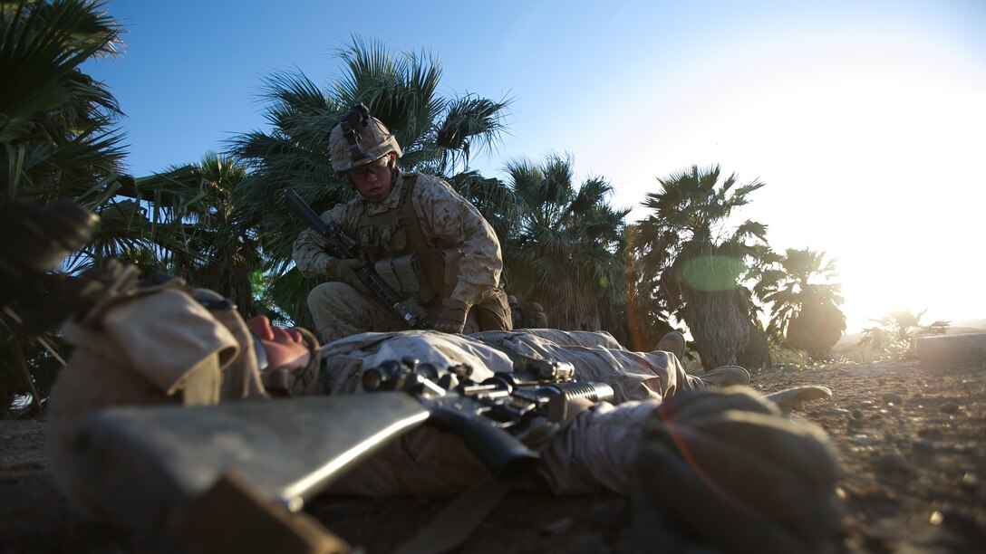 U.S. Marine Corps infantrymen with 1st Battalion, 5th Marine Regiment, 1st Marine Division participate in a heavy huey raid exercise during Weapons and Tactics Instructor (WTI) Course 2-15 at Yuma Proving Grounds near Yuma, Ariz., April 8, 2015. WTI is a seven-week event hosted by Marine Aviation Weapons and Tactics Squadron One (MAWTS-1) cadre. MAWTS-1 provides standardized tactical training and certification of unit instructor qualifications to support Marine aviation Training and Readiness and assists in developing and employing aviation weapons and tactics. 