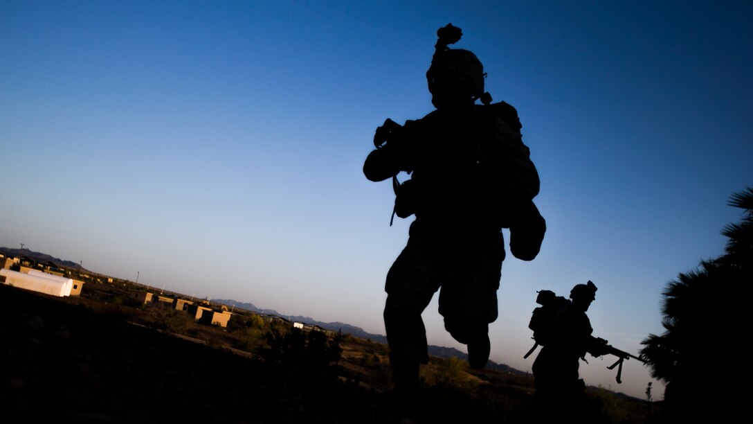 U.S. Marine Corps infantrymen with 1st Battalion, 5th Marine Regiment, 1st Marine Division participate in a heavy huey raid exercise during Weapons and Tactics Instructor (WTI) Course 2-15 at Yuma Proving Grounds near Yuma, Ariz., April 8, 2015. WTI is a seven-week event hosted by Marine Aviation Weapons and Tactics Squadron One (MAWTS-1) cadre. MAWTS-1 provides standardized tactical training and certification of unit instructor qualifications to support Marine aviation Training and Readiness and assists in developing and employing aviation weapons and tactics. 