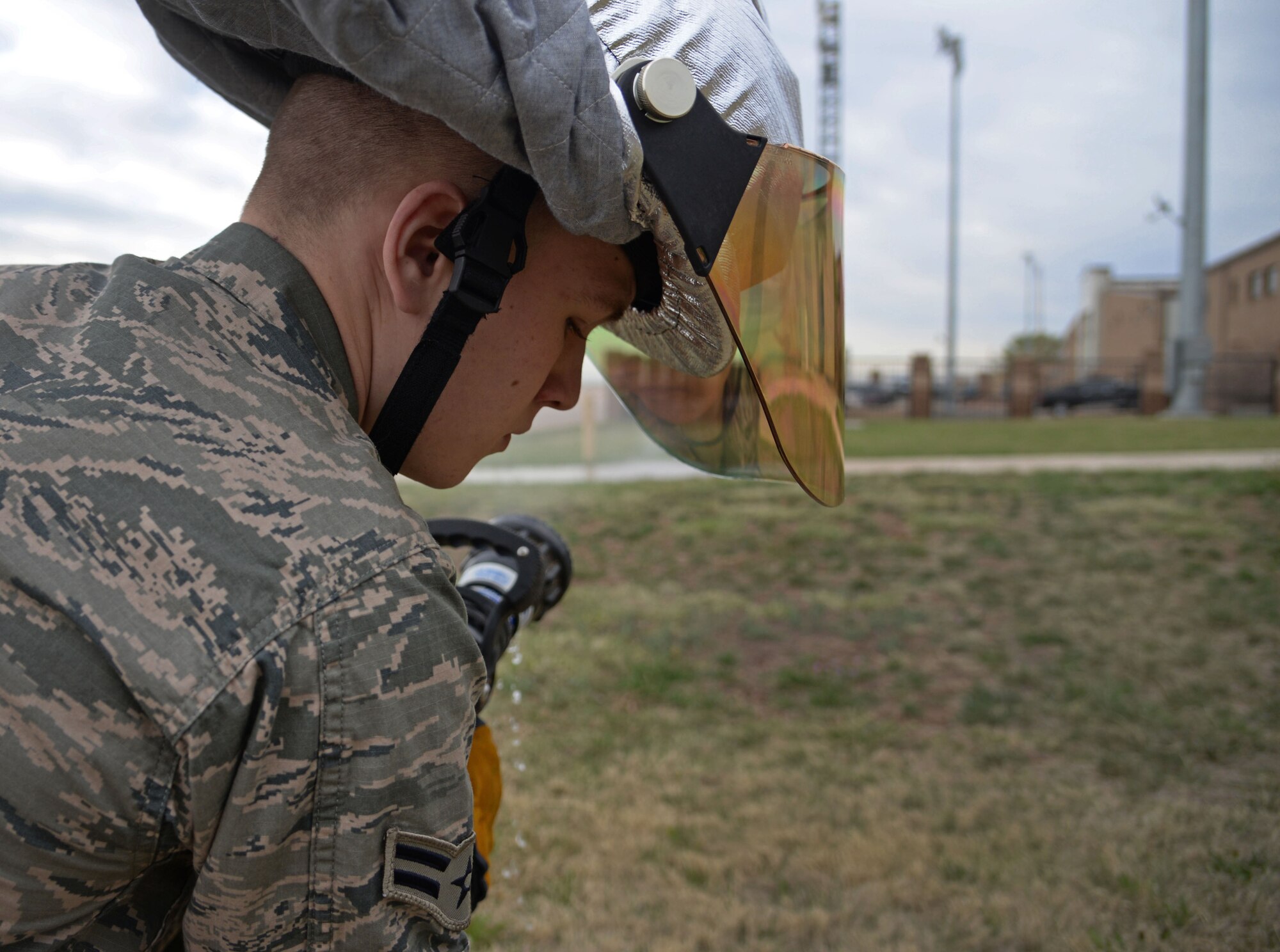 U.S. Air Force Airman 1st Class Tyler Foster, 27th Special Operations Civil Engineer Squadron firefighter, tests hose operability April 8, 2015 at Cannon Air Force Base, N.M. Cannon’s fire protection crew conducts daily ops checks of all essential equipment following morning roll call. (U.S. Air Force photo/Staff Sgt. Alex Mercer) 
