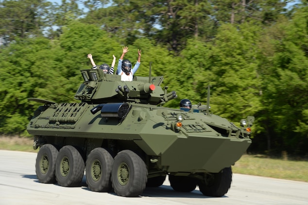 Members of the Leadership Albany Class of 2015 ride around Marine Depot Maintenance Command/Production Plant Albany's test track. They participated in daylong activities aboard Marine Corps Logistics Base Albany, April 9. Representing various local businesses in Albany, the group learned about MCLB Albany and its tenant commands’ missions and roles in the Marine Corps.