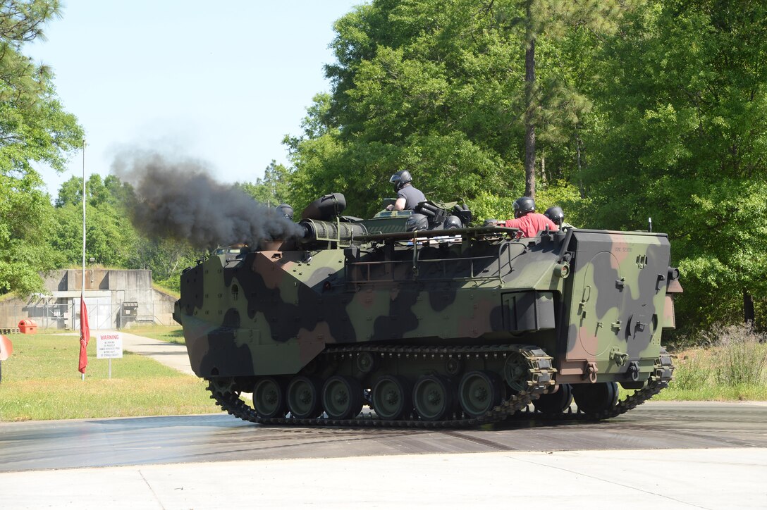 Members of Leadership Albany Class of 2015 ride in an assault amphibious vehicle on Marine Depot Maintenance Command/Production Plant Albany's test track. The group participated in daylong activities aboard Marine Corps Logistics Base Albany, April 9. Representing various local businesses in Albany, the group learned about MCLB Albany and its tenant commands’ missions and roles in the Marine Corps.