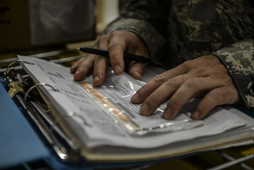 Staff Sgt. Christopher Hollowood, 1st Special Operations Logistics Readiness Squadron CV-22 Osprey parts store supervisor, checks parts numbers at Hurlburt Field, Fla., April 7, 2015. The Osprey parts store provides efficient supply, expert management and service to accomplish accurate and rapid response to the Osprey’s mission supporting global military operations. (U.S. Air Force photo/Senior Airman Christopher Callaway) 