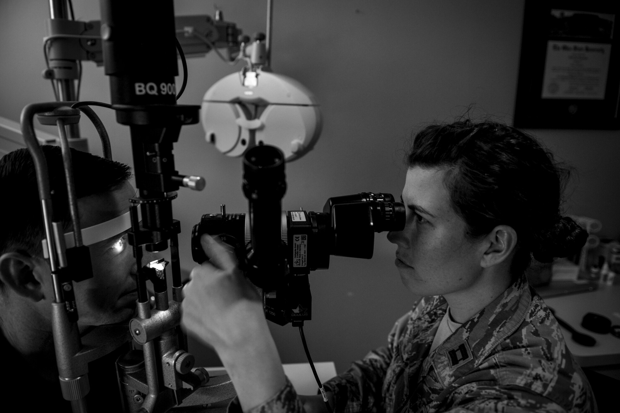 Capt. Nikki Lagendyk, 1st Special Operations Aerospace Medical Squadron optometrist, scans Master Sgt. Andrew Maresh, 1st Special Operations Wing operations security manager’s eyes, during a routine eye exam at the 1st Special Operations Medical Group on Hurlburt Field, Fla., April 8, 2015. Lagendyk used a split-lamp to examine the health of Maresh’s eyes. (U.S. Air Force photo/Senior Airman Christopher Callaway) 