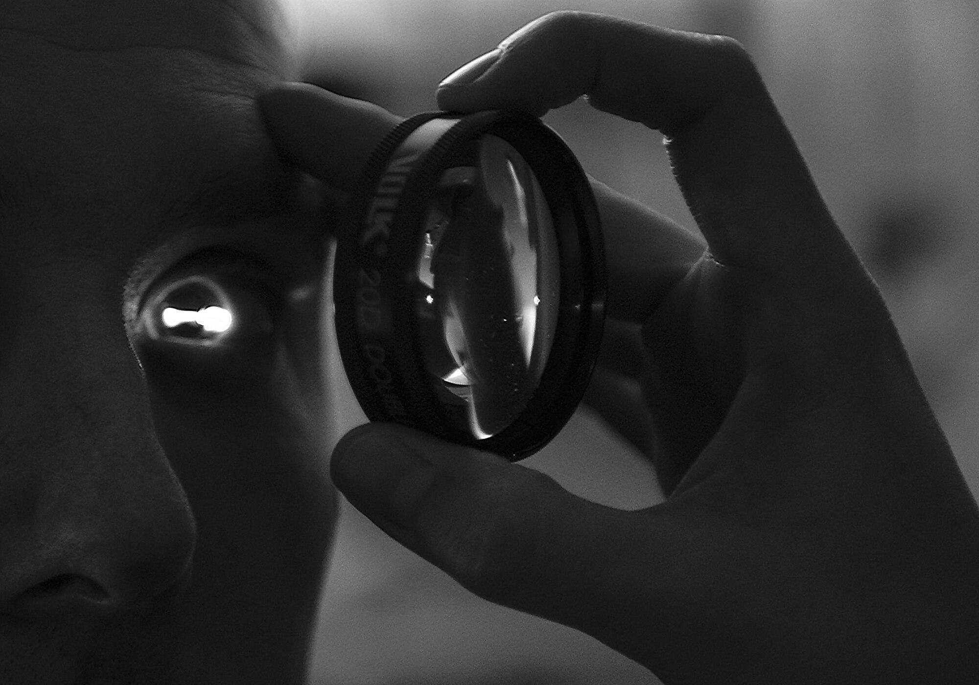 Master Sgt. Andrew Maresh, 1st Special Operations Wing operations security manager, goes through a routine eye exam at the 1st Special Operations Medical Group on Hurlburt Field, Fla., April 8, 2015. During an eye exam; an optometrist dilates a patient’s eye to view the internal structures of the eyeball.  (U.S. Air Force photo/Senior Airman Christopher Callaway) 