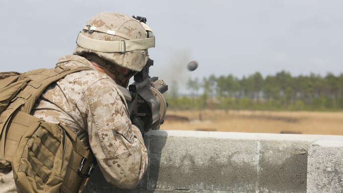 Lance Cpl. Austin Steifer, a rifleman with 2nd Battalion, 2nd Marine Regiment, fires the M32 grenade launcher during a live-fire range aboard Camp Lejeune, N.C., April 9, 2015.  The M32 is a semi-automatic grenade launcher capable of holding up to six 40mm rounds and reaching a distance up to 400 meters.  (U.S. Marine Corps photo by Cpl. Michael Dye/Released) 