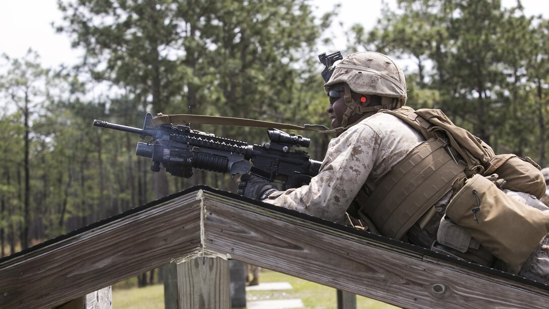 Lance Cpl. Jaylyn Bush, a rifleman with 2nd Battalion, 2nd Marine Regiment, fires the M203 rifle-mounted grenade launcher during a live-fire range aboard Camp Lejeune, N.C., April 9, 2015.  The M203 is a single-shot grenade launcher capable of accuracy up to 350 meters on an area target and 150 meters on a point target.  (U.S. Marine Corps photo by Cpl. Michael Dye/Released)