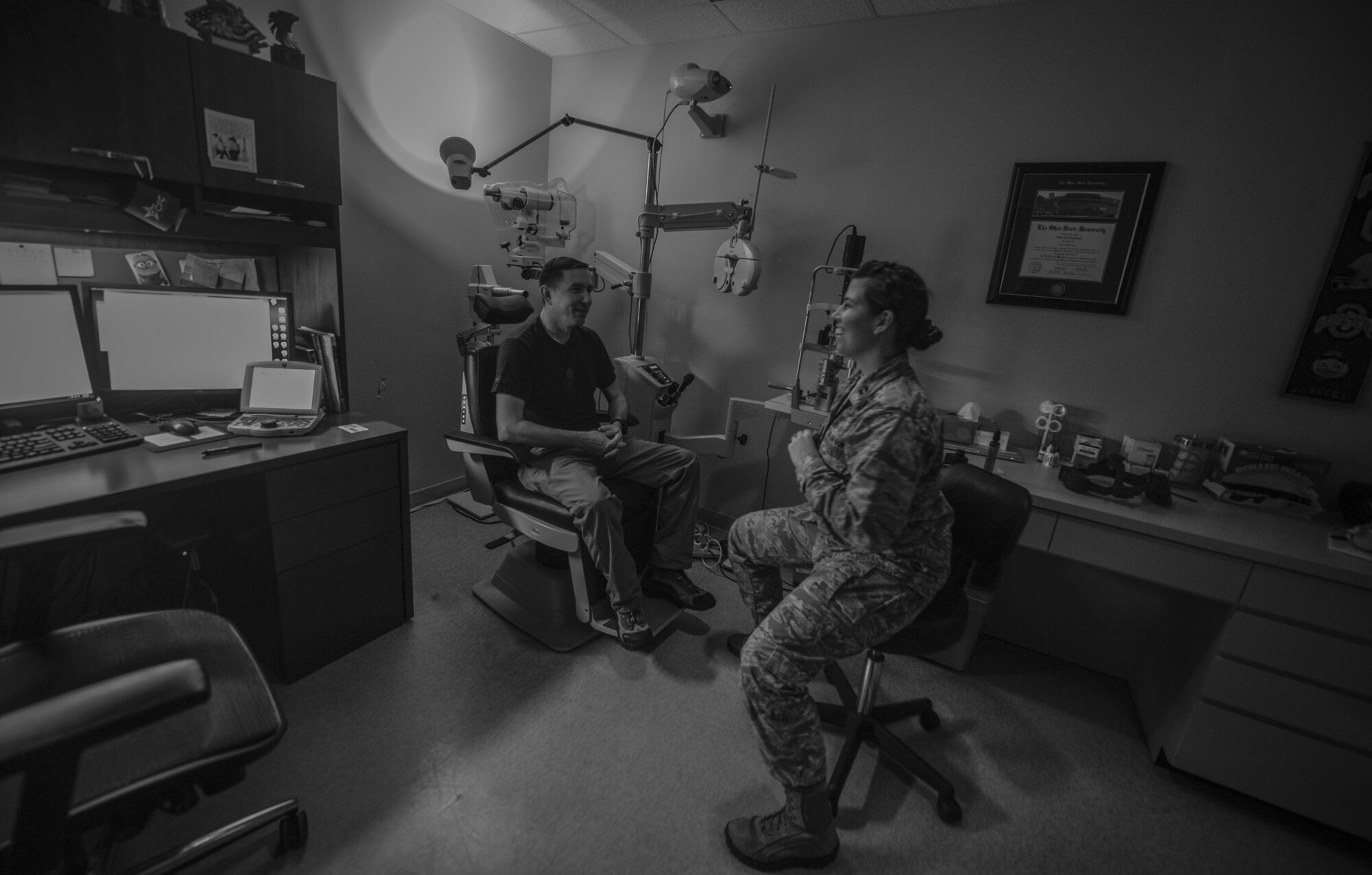 Capt. Nikki Lagendyk, 1st Special Operations Aerospace Medical Squadron optometrist, and Master Sgt. Andrew Maresh, 1st Special Operations Wing operations security manager, discuss the results of a routine eye exam at the 1st Special Operations Medical Group on Hurlburt Field, Fla., April 8, 2015. The 1st SOMDG’s mission is to provide exceptional deployment medicine, readiness support, fit and healthy warfighters and access for Air Commandos and their families. (U.S. Air Force photo/Senior Airman Christopher Callaway) 