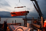 WATERS SOUTH OF THE KOREAN PENINSULA, (April 8, 2015) - Sailors from the mine countermeasure ship USS Chief (MCM 14) lower a mine neutralization vehicle into position on the ship's fantail, after mine sweeping training in waters south of the Korean peninsula. Chief is participating in Exercise Foal Eagle 2015, a series of annual training events that are defense-oriented and designed to increase readiness and maintain stability on the Korean Peninsula while strengthening the Republic of Korea-U.S. alliance and promoting regional peace and stability in the Indo-Asia-Pacific region. 