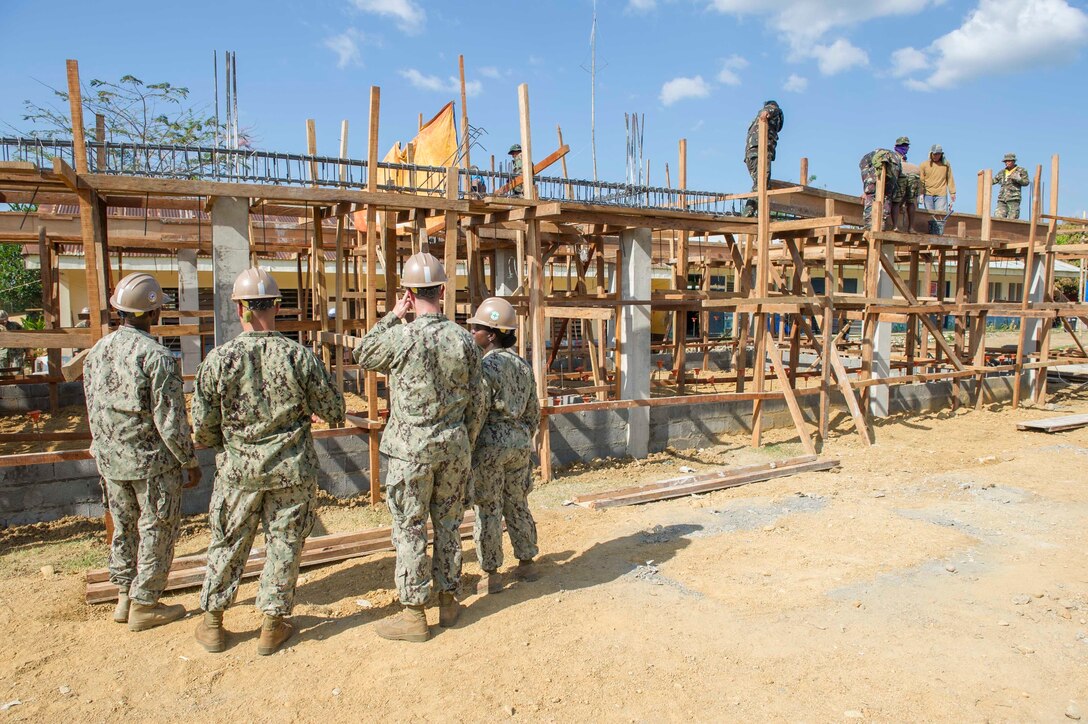 U.S. Navy Seabees assigned to Naval Mobile Construction Battalion 5, and Philippine Army engineers work together at the Don Joaquin Artuz Memorial Elementary School construction project during Balikatan 2015. The Seabees and U.S. Marines will join Armed Forces of the Philippines engineers from the 552nd Engineering Construction Battalion, currently at work on the project, in building two classrooms at the school as part of a Combined Joint Civil-Military Operations Task Force on the island of Panay. Balikatan, which means “shoulder to shoulder” in Filipino, is an annual bilateral training exercise aimed at improving the ability of Philippine and U.S. military forces to work together during planning, contingency, humanitarian assistance and disaster relief operations.