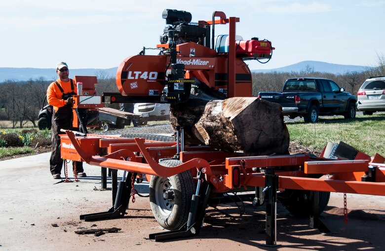 Retired Lt. Col. Rusty Sears operates his portable sawmill April 6.