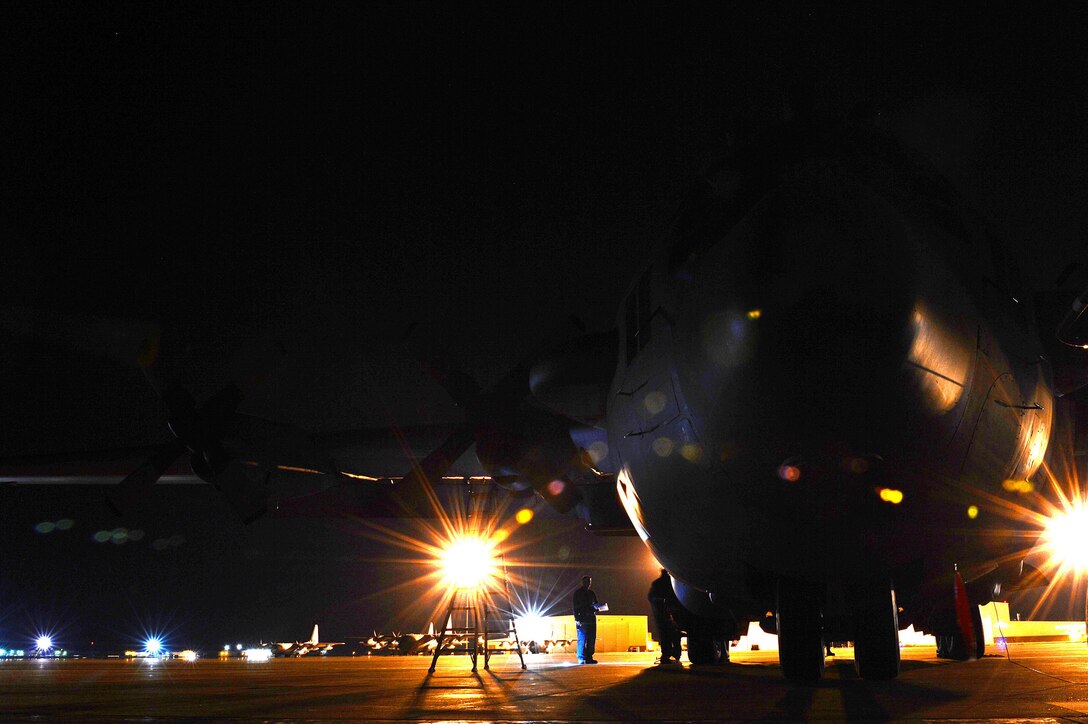 Members of the 27th Special Operations Aircraft Maintenance Squadron begin a routine inspection of "Heavy Metal," an AC-130H Spectre gunship April 8, 2015 at Cannon Air Force Base, N.M. Maintenance crews work all hours to ensure that all 27th Special Operations Wing air frames are fully operational before aircrew members arrive for flight operations. (U.S. Air Force photo/Staff Sgt. Matthew Plew)