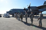 Florida National Guard Soldiers from the Lake City-based A Company, 53rd Brigade Special Troops Battalion, board a C-130 transport plane at Cecil Commerce Center for JRTC on April 9, 2015.