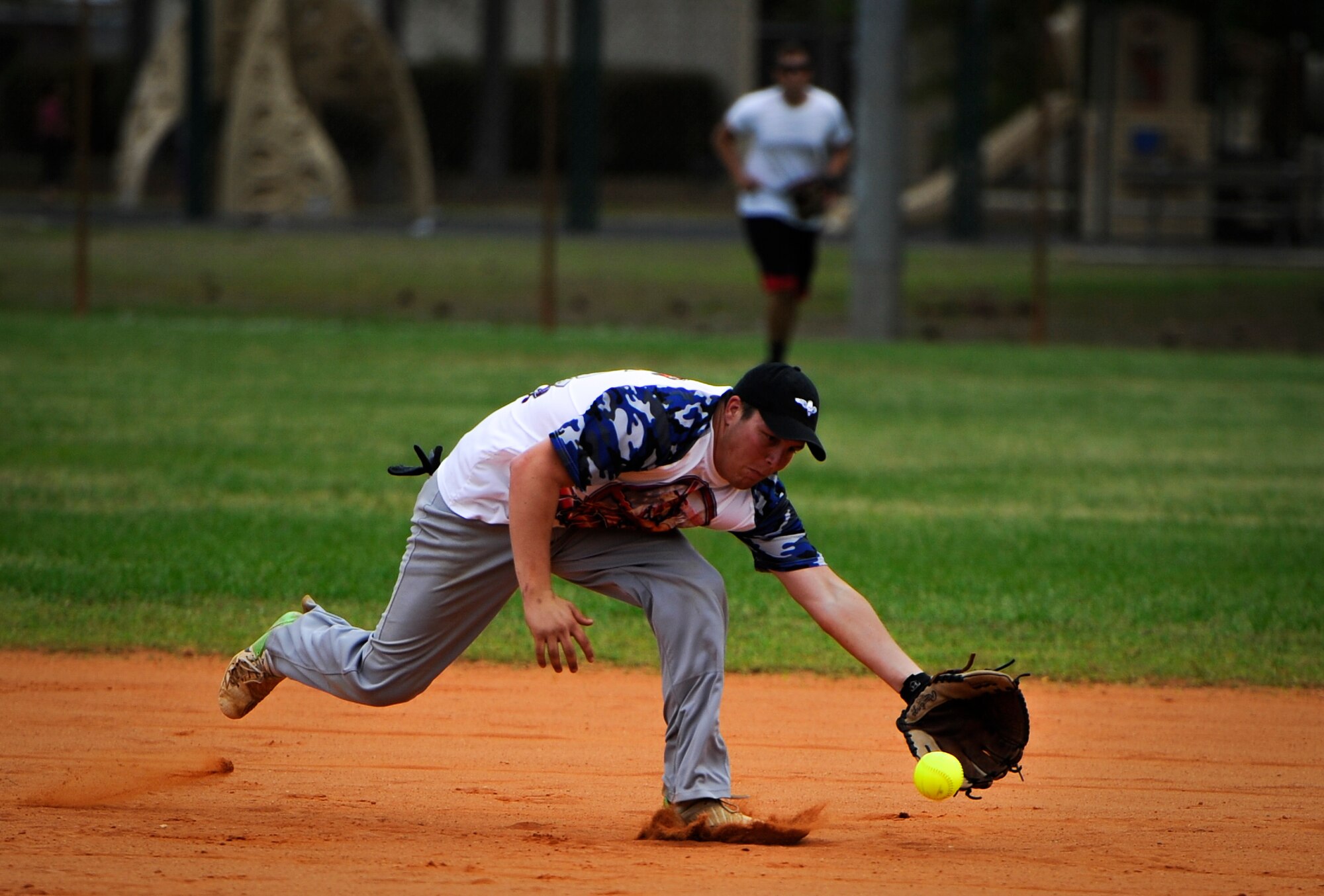 Michael Maier, 25th Intelligence Squadron short stop, fields a ground ball during a softball game at Hurlburt Field, Fla., April 6, 2015. The game led off the annual Hurlburt Field Intramural Softball season. (U.S. Air Force photo/Senior Airman Christopher Callaway)