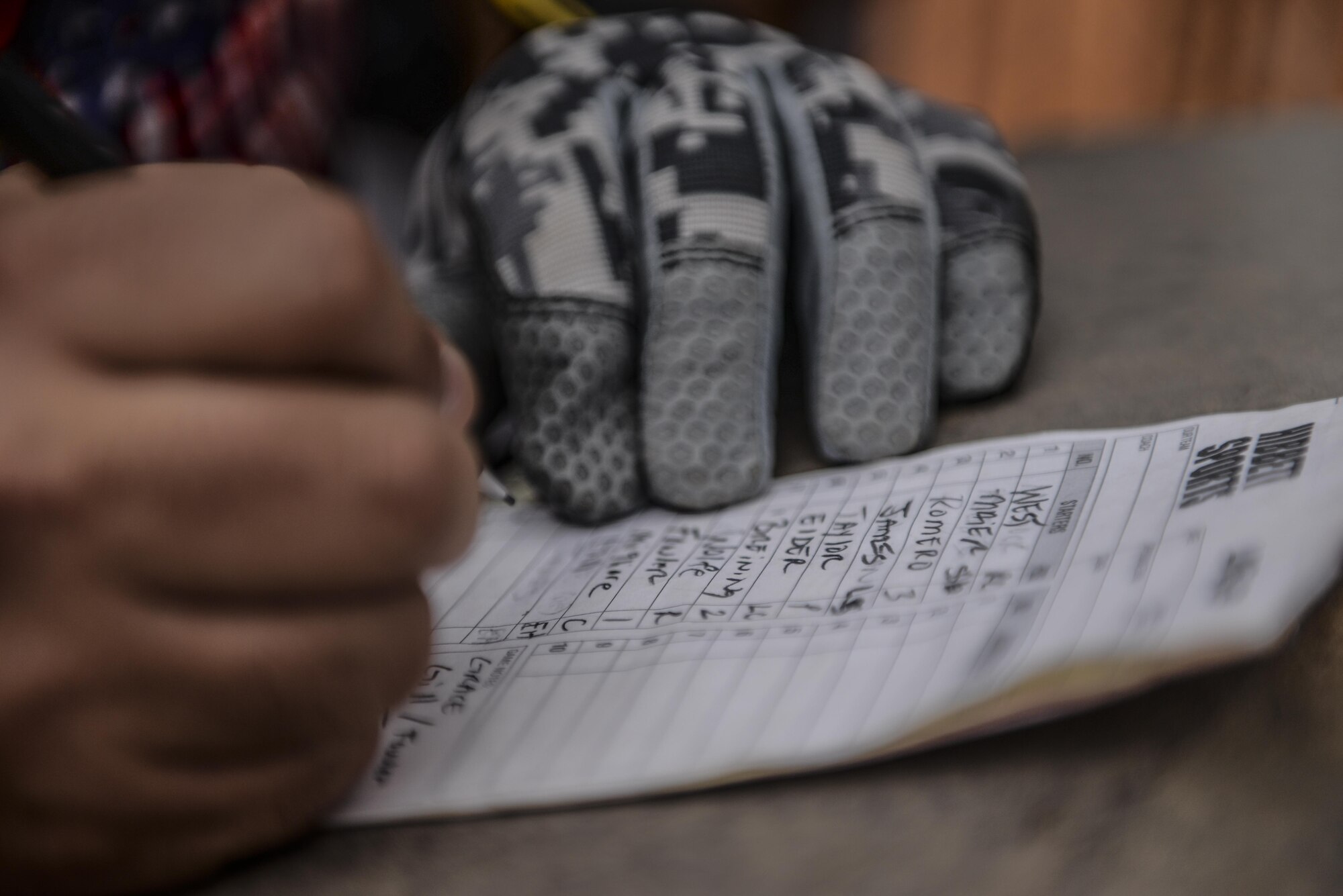 A 25th Intelligence Squadron player creates a line up before a softball game at Hurlburt Field, Fla., April 6, 2015. The game led-off the annual Hurlburt Field Intramural Softball season. (U.S. Air Force photo/Senior Airman Christopher Callaway)