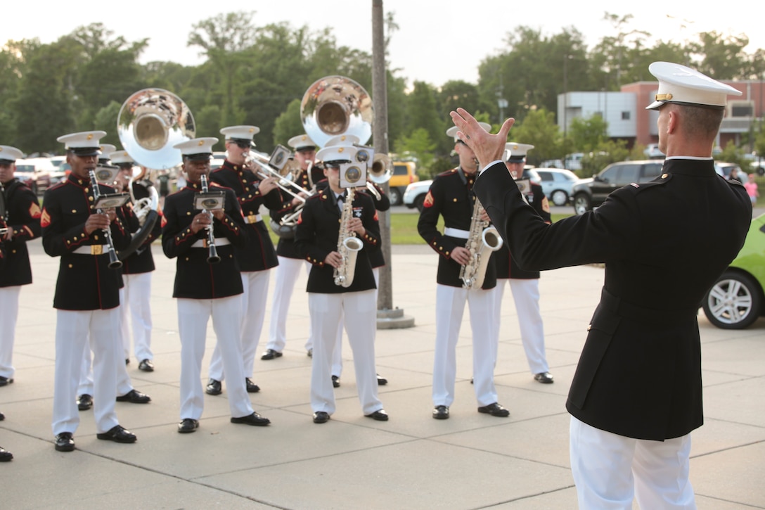 Chief Warrant Officer 3 Bryan Sherlock, officer in charge, leads Marine Corps Band New Orleans during the New Orleans Zephyrs baseball game at Zephyr Field, April 9, 2015.The band opened the night with a repertoire of traditional marches, New Orleans-inspired songs and currently popular songs to entertain the audience before the game began. By playing in different events, the band is able to enhance the connection and relationship between the Marine Corps and the New Orleans community.  (U.S Marine Corps photo by Lance Cpl. Ian Ferro)