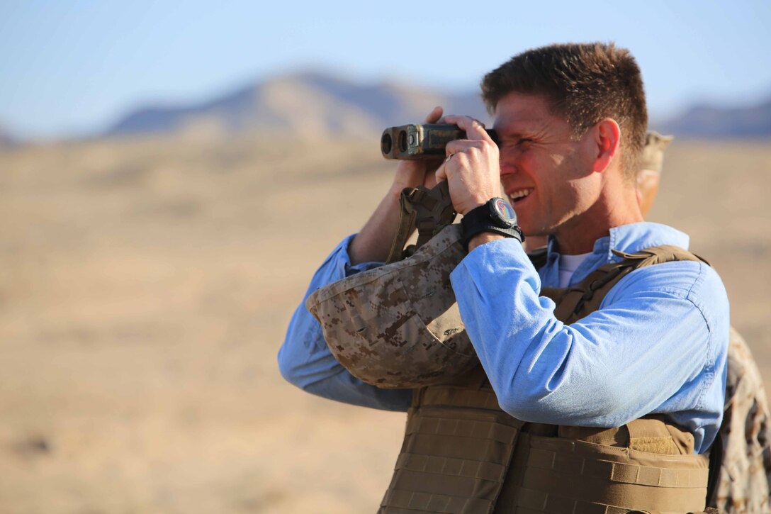 Assistant Secretary of the Navy (Manpower and Reserve Affairs) Juan M. Garcia III observes Marines with Company A, Ground Combat Element Integrated Task Force as they conduct a Marine Corps Operational Test and Evaluation Activity assessment at Range 107, Marine Corps Air Ground Combat Center Twentynine Palms, California, April 7, 2015. From October 2014 to July 2015, the GCEITF will conduct individual and collective level skills training in designated ground combat arms occupational specialties in order to facilitate the standards-based assessment of the physical performance of Marines in a simulated operating environment performing specific ground combat arms tasks. (U.S. Marine Corps photo by Cpl. Paul S. Martinez/Released) 