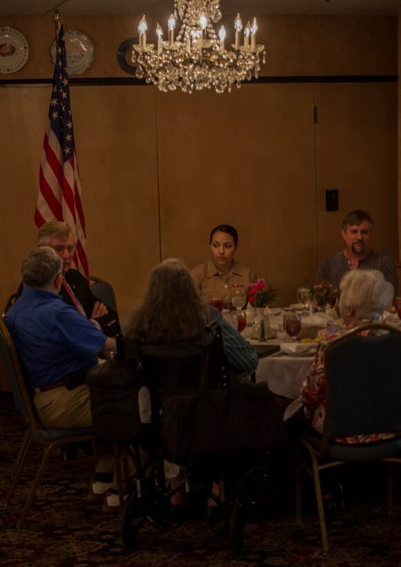 Lance Cpl. Samantha P. Bowling, administrative clerk with Marine Forces Reserve, sits with retired Marines from the Marine Support Group at Andrea’s Restaurant in New Orleans, April 10, 2016. Young Marines had the opportunity to spend time with Marines who served in WWI and WWII and hear about their experiences in the Corps. Through the ages, Marines young and old, regardless of gender, religion or race, all share a common bond through the eagle, globe and anchor that each wears proudly across their heart.  