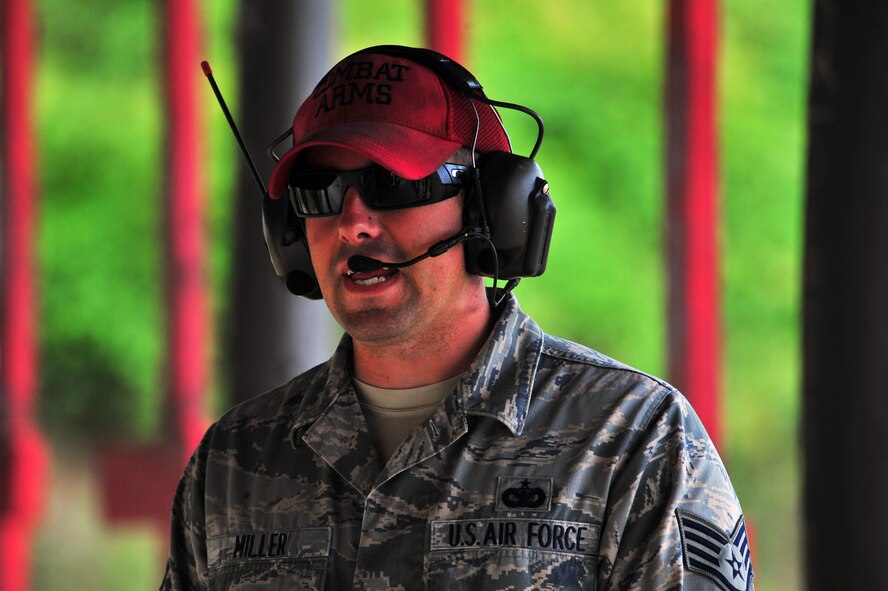 Staff Sgt. Darrin Miller, 1st Special Operations Security Forces Squadron combat arms training and maintenance instructor, yells instructions during an M-4 Carbine qualification course, April 9, 2015, at Hurlburt Field, Fla. CATM instructors are subject matter experts on several weapon systems and must ensure Airmen are qualified to carry a weapon during deployments. (U.S. Air Force photo/Airman 1st Class Ryan Conroy)
